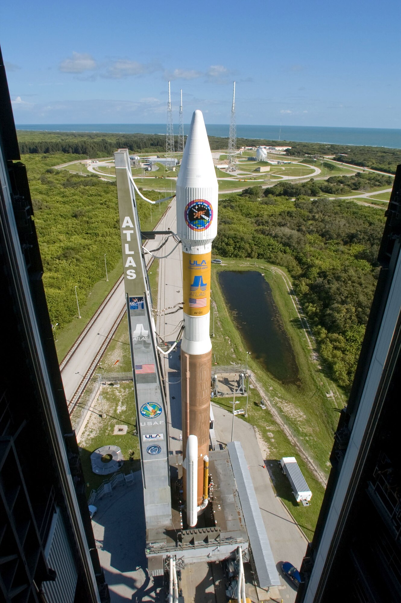 The Atlas V rocket with the Wideband Global SATCOM satellite rolls out to Space Launch Complex 41 from the Vertical Integration Building Oct. 9 at Cape Canaveral Air Force Station, Fla. The Atlas V was rolled to the pad in preparation for the launch of the first WGS satellite, which took place Oct. 10. (Courtesy photo/United Launch Alliance/Karl Ronstrom) 