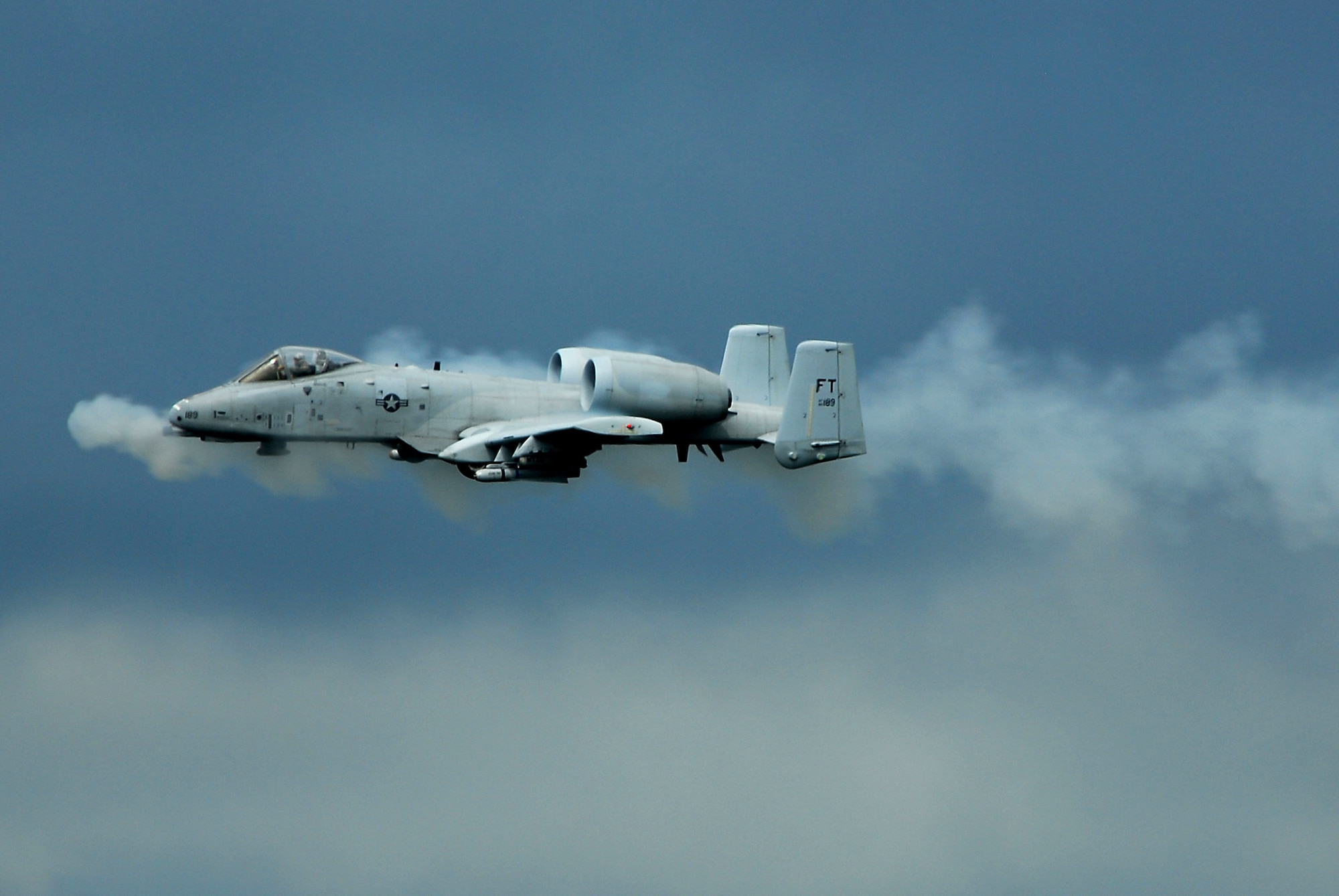 An A-10 Thunderbolt II ground attack aircraft performs a low-level strafing run with its 30 mm cannon during a combat search and rescue demonstration at Moody Air Force Base, Ga., Oct. 4. The digitally upgraded A-10 has been equipped with satellite-guided precision weaponry and advanced communications data links for transferring information with ground-based warfighters. (U.S. Air Force photo/Tech. Sgt. Parker Gyokeres)
