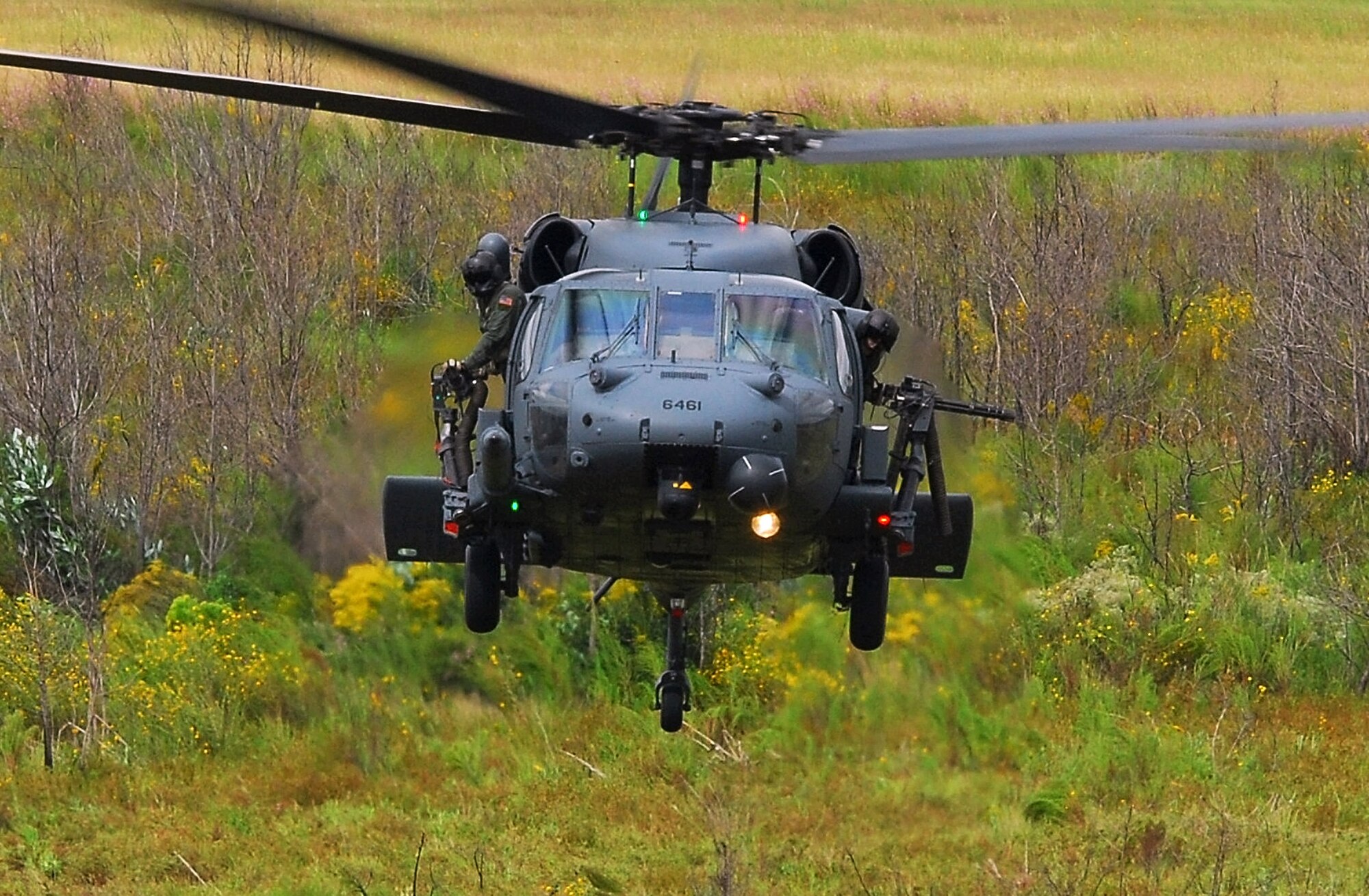 An HH-60G Pave Hawk from the 41st Rescue Squadron hovers during a combat search and rescue demonstration at Moody Air Force Base, Ga., Oct. 4. The primary role of the HH-60G is to conduct day or night CSAR operations into hostile environments to recover downed aircrew or other isolated military members during war. (U.S. Air Force photo/Tech. Sgt. Parker Gyokeres)