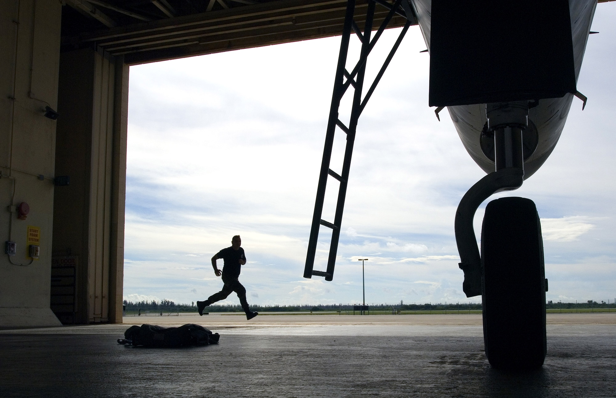 Crew chief Staff Sgt. Thomas Fitzgerald sprints to his F-15 Eagle after an alert alarm announces the immediate launch of aircraft during a training exercise for Operation Noble Eagle Oct. 3 at the 125th Fighter Wing, Det. 1, Homestead Air Reserve Base, Fla. The detachment provides the Continental NORAD Region commander rapid response to invasion of the sovereign airspace of the U.S., and responds with appropriate defense measures against all hostile actions directed at the people and property of the U.S. during Operation Noble Eagle. (U.S. Air Force photo/Staff Sgt. Bennie J. Davis III) 