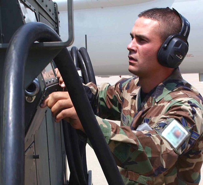 Airman 1st Class Josh Varner, 552nd Maintenance Squadron Aerospace Ground Equipment section, starts an air conditioning unit used to cool the E-3 while it is on the ground at home and deployed. (Air Force photo by Staff Sgt. Stacy Fowler)