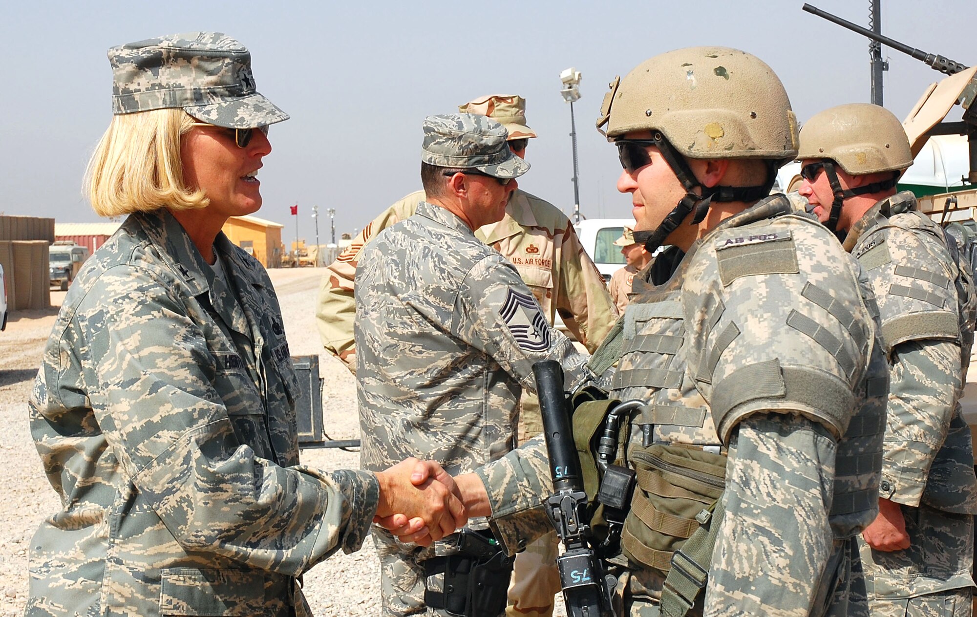 Brig. Gen. Mary Kay Hertog visits with deployed Airmen to discuss deployment tempos, training and the future of the career field Oct. 10 at Camp Bucca, Iraq. General Hertog is the Air Force Security Forces director. (U.S. Air Force photo/Staff Sgt. Tia Schroeder)
