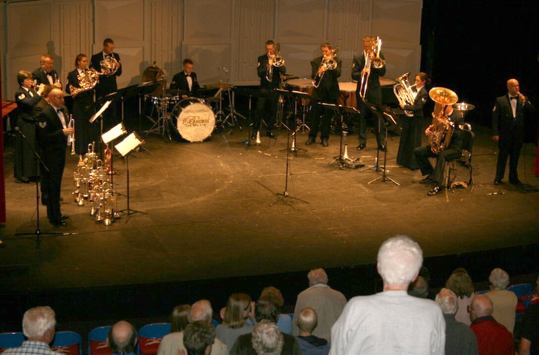 The USAF Heartland of America Band's Brass in Blue brought the audience to their feet during a performance of "The Battle Hymn of the Republic" in Pequot Lakes, MN.  The group perfomed seven concerts in northern Minnesota, and each night this piece was dedicated to all men and women serving in the military around the globe. 
