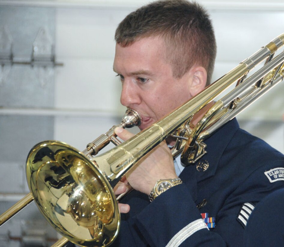 SSgt Ben Kadow, trombonist with the USAF Heartland of America Band's Offutt Brass, performed pre-ceremony music for the dedication of Offutt AFB's new Airman Leadership School building.