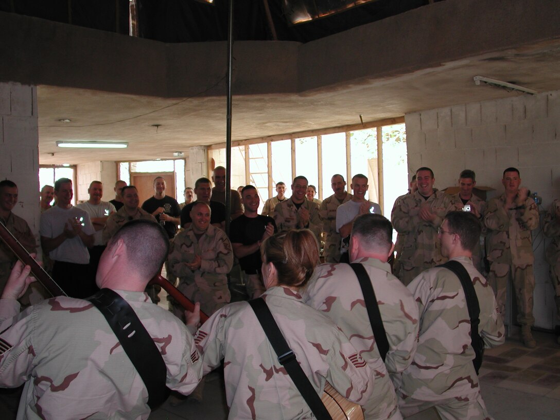 Night Wing’s “guitar” section entertains deployed firefighters at Kirkuk Airbase, Iraq.
