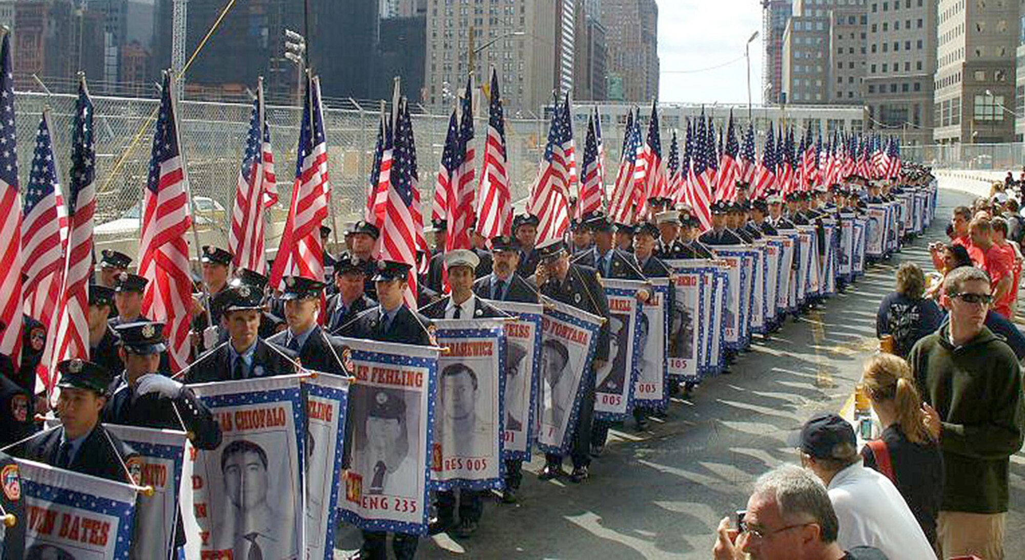 New York City firefighters march after the Tunnel to Towers Run, which honored those who died in the 9/11 terrorist attacks. Each firefighter held a different poster with the name and picture of someone who died, including Stephen Siller, who ran three miles to ground zero to help after hearing about the attacks. (Courtesy photo)