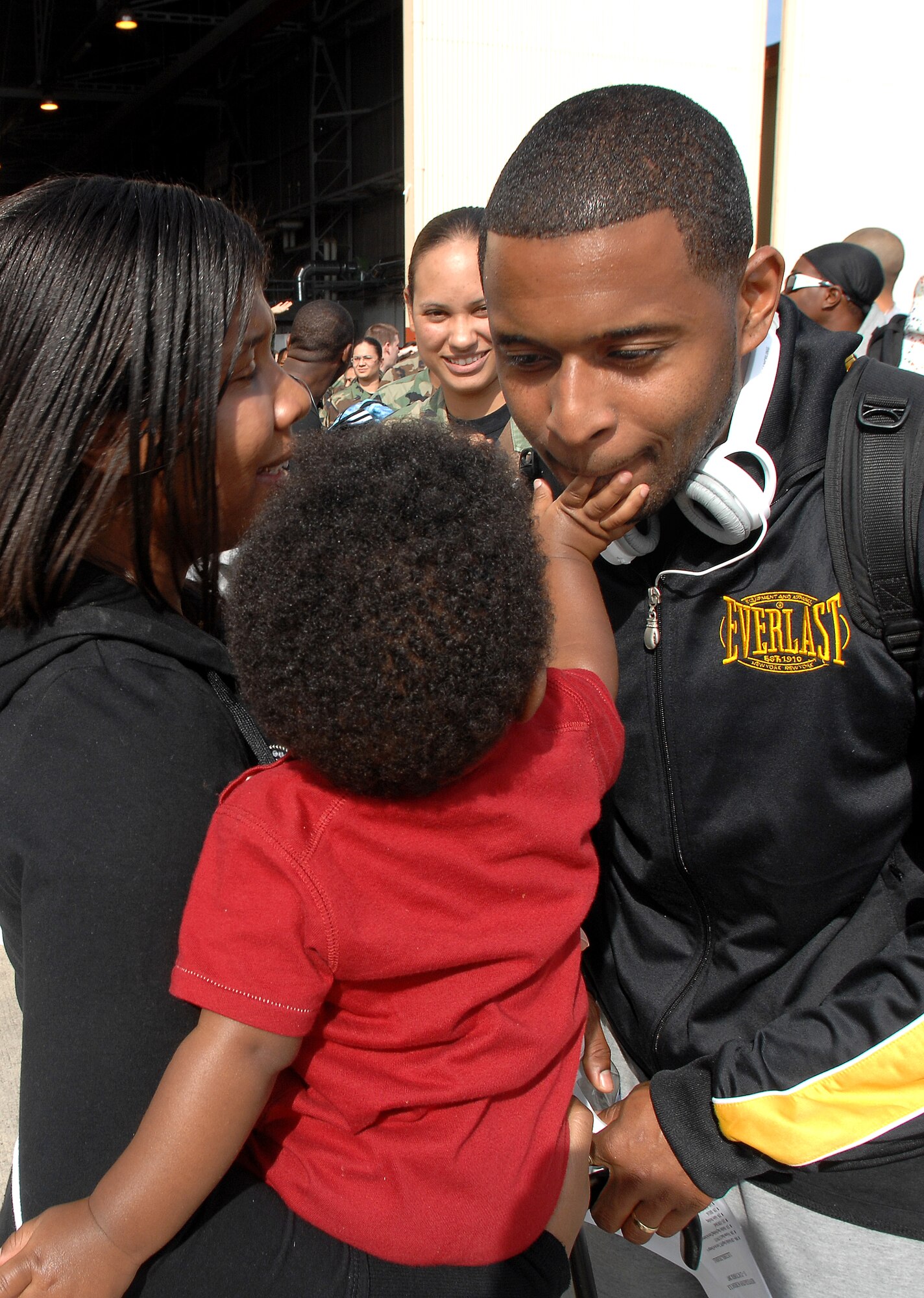 AVIANO AIR BASE, Italy-- Staff Sgt. Tirrell Gordon, 31st Aircraft Maintenance Squadron, reunites with his wife and son Tuesday on the flightline during Operation Welcome Home.  ( U.S. Air Force photo/Airman 1st Class Nathan Doza ) 