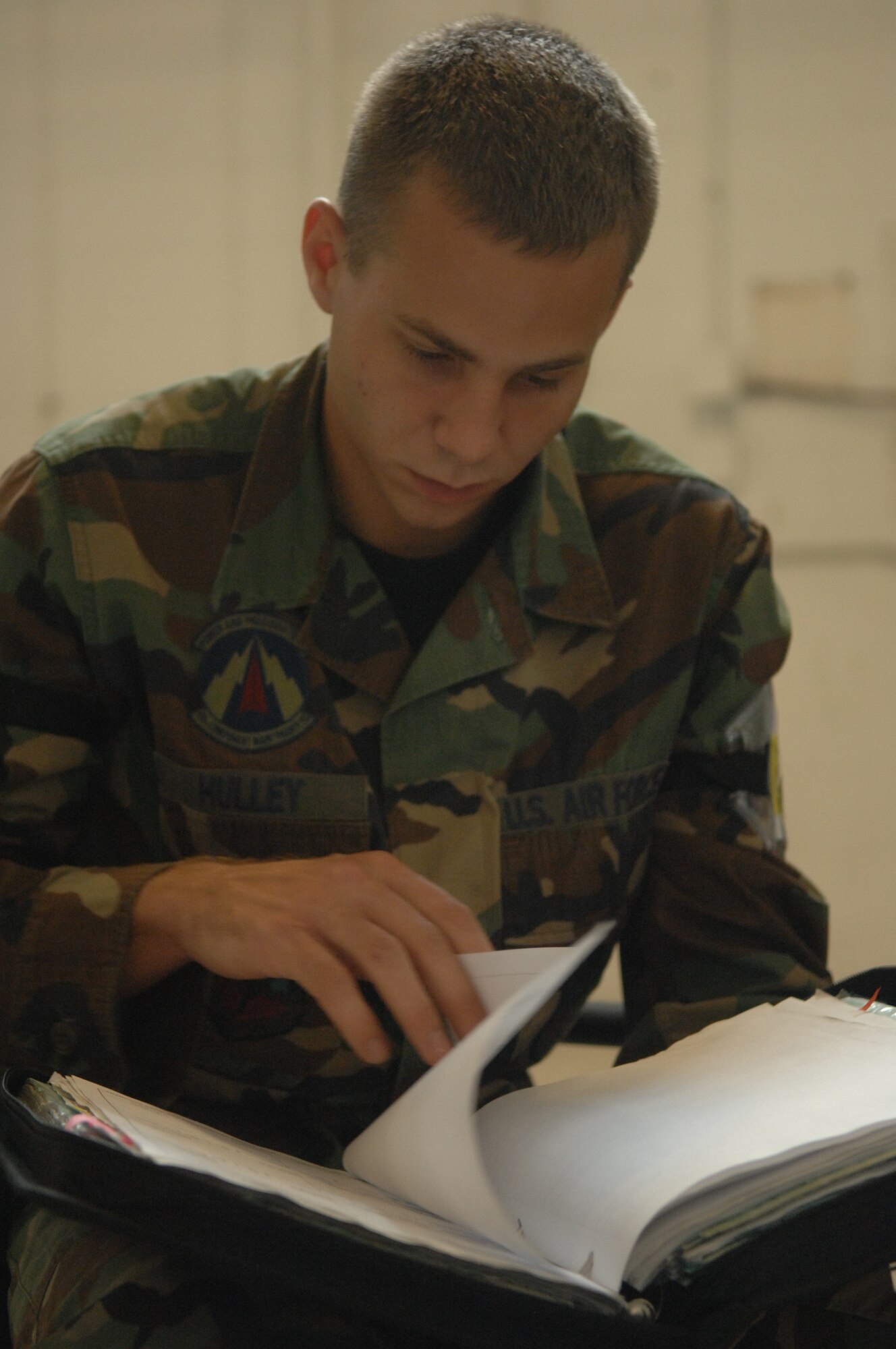 SHAW AIR FORCE BASE, S.C. -- Senior Airman Matt Hulley, 20th Component Maintenance Squadron egress technician, looks for open discrepancies on F-16 forms during an operational readiness exercise (ORE), October 10, 2007. The ORE will prepare Airmen for future deployments in a combat environment. (U.S. Air Force photo/Staff Sgt. Nathan Bevier) 
