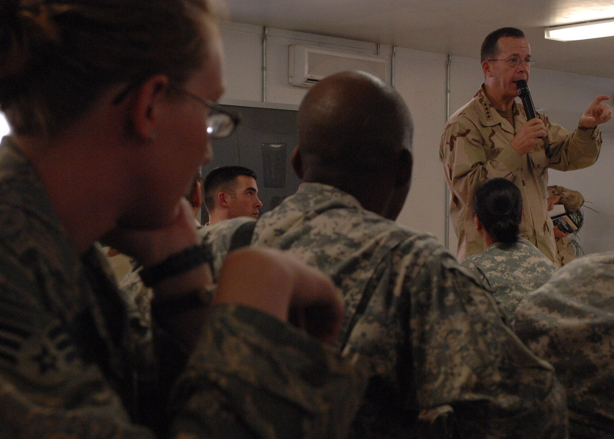 BAGRAM AIRFIELD, Afghanistan -- Admiral Michael Mullen,  Chairman of the Joint Chiefs of Staff, thanks servicemembers for their service during an “All-Hands Call” for E-6s and below here Oct 7.  (U.S. Air Force Photo by Staff Sgt. Joshua Jasper)