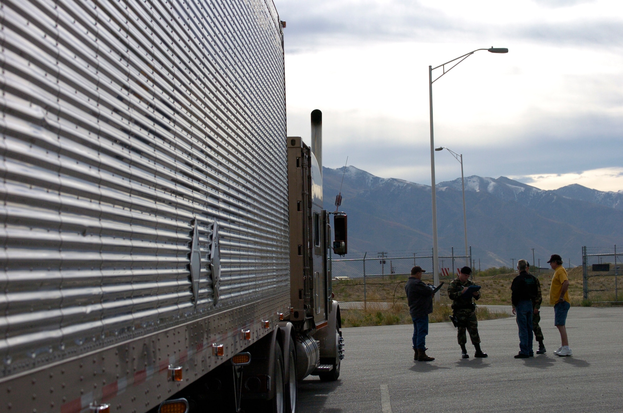 Airman 1st Class James Mustain, 75th Security Forces Squadron patrolman, fills out paperwork to permit munitions deliveries entry onto Hill Air Force Base. Once escorted onto base, the 649th Munitions Squadron unloads the ammunition and send the delivery trucks on their way.