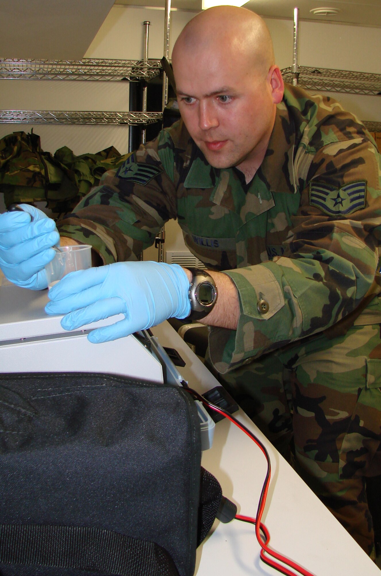 Staff Sgt. Jason Willis, 71st Medical Group Bioenvironmental Engineering, checks water purity for water-borne bacteria during a Medical Unit Readiness Training exercise Oct. 11. The annual training ensures medical personnel are prepared to perform their duties in a deployed environment. (U.S. Air Force photo by Tech. Sgt. Mary Davis)                                                               