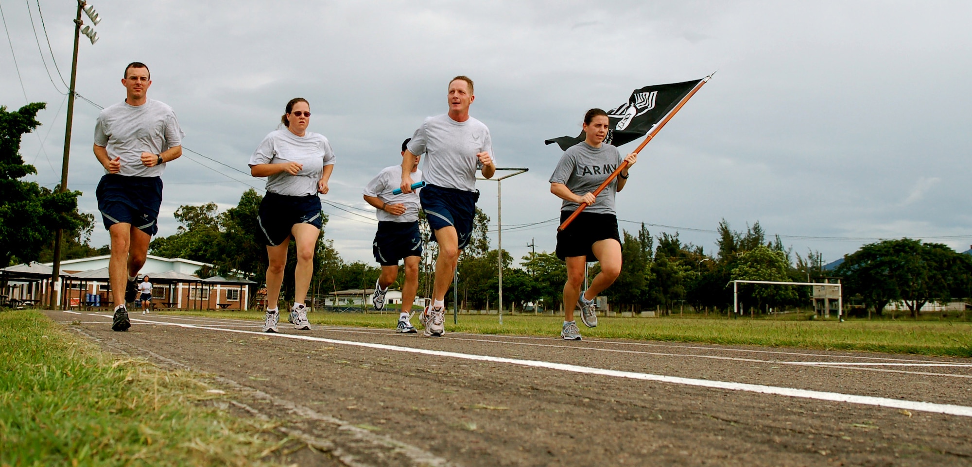 SOTO CANO AIR BASE, Honduras – The first group of runners in the Joint Task Force-Bravo Prisoner of War/Missing in Action 24-hour Remembrance Run complete their first lap at about 9:02 a.m. Oct. 11.  A total of approximately 170 participants ran in mostly 15-minute intervals for 24 hours to show support for their fellow servicemembers who have been listed as POW/MIA.  (U.S. Air Force photo by Staff Sgt. Austin M. May)