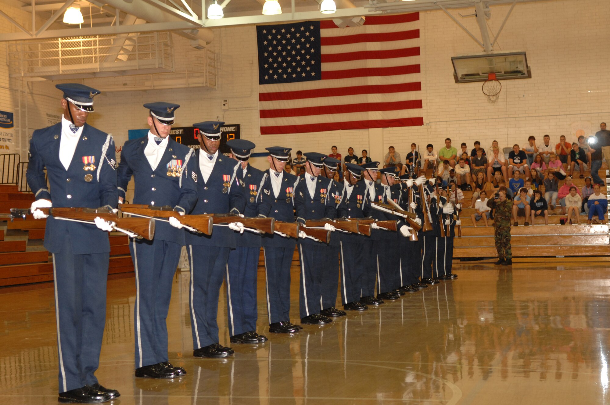 Members of the Air Force Honor Guard Drill Team perform at Etowah High School in Etowah, Ga. on October 10, 2007.  The drill team visited several area high schools, with other Air Force demo teams, as part of Air Force Week Atlanta events leading up to the Great Georgia Air Show in Peachtree City, Ga., and promoted the AF mission by showcasing drill performances at public and military venues to recruit, retain, and inspire Airmen. ( U.S. Air Force photo/Airman First Class Tim Chacon)(Released)