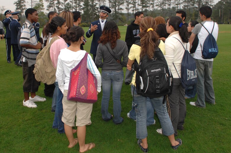 Senior Airman Ruben Chavez, Drill Team member, speaks with students following  a performance at Marietta High School in Marietta, Ga. on October 9, 2007.  The drill team performed at several area high schools, with other Air Force demo teams, as part of Air Force Week Atlanta events leading up to the Great Georgia Air Show in Peachtree City, Ga., and promoted the AF mission by showcasing drill performances at public and military venues to recruit, retain, and inspire Airmen. ( U.S. Air Force photo/Airman First Class Tim Chacon)(Released)