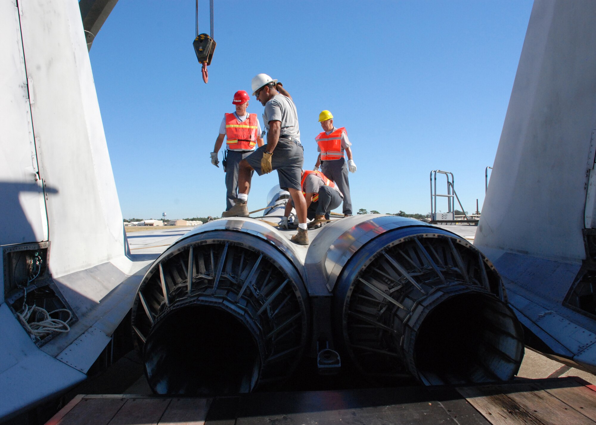 EGLIN AIR FORCE, Fla. -- Members of Indyne Inc. U.S. Targets, 46th Test Wing and the 33rd Maintenance Squadron work to secure an F-15 on a trailer Oct. 12 to to move it to an Eglin range for future testing missions. The crew, lifted the aircraft, collapsed the landing gear and hoisted it onto a flatbed trailer to be transported to Range 52 off Range Road 213. They are scheduled to move the jet beginning at 2 a.m. Oct. 13. (U.S Air Force Photo by Staff Sgt. Mike Meares)
