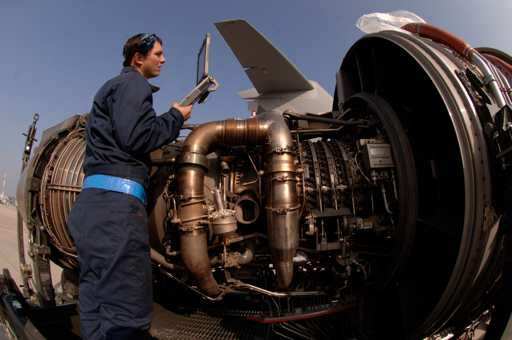 Staff Sgt. Erik Marsaln reviews C-17 engine technical orders on his laptop to guide him through an engine change-out on a C-17 Globemaster III at Ramstein Air Base, Germany, Oct. 11. Sergeant Marsaln is assigned to the 723rd Air Mobility Squadron. (U.S. Air Force photo/Master Sgt. Scott Wagers)
