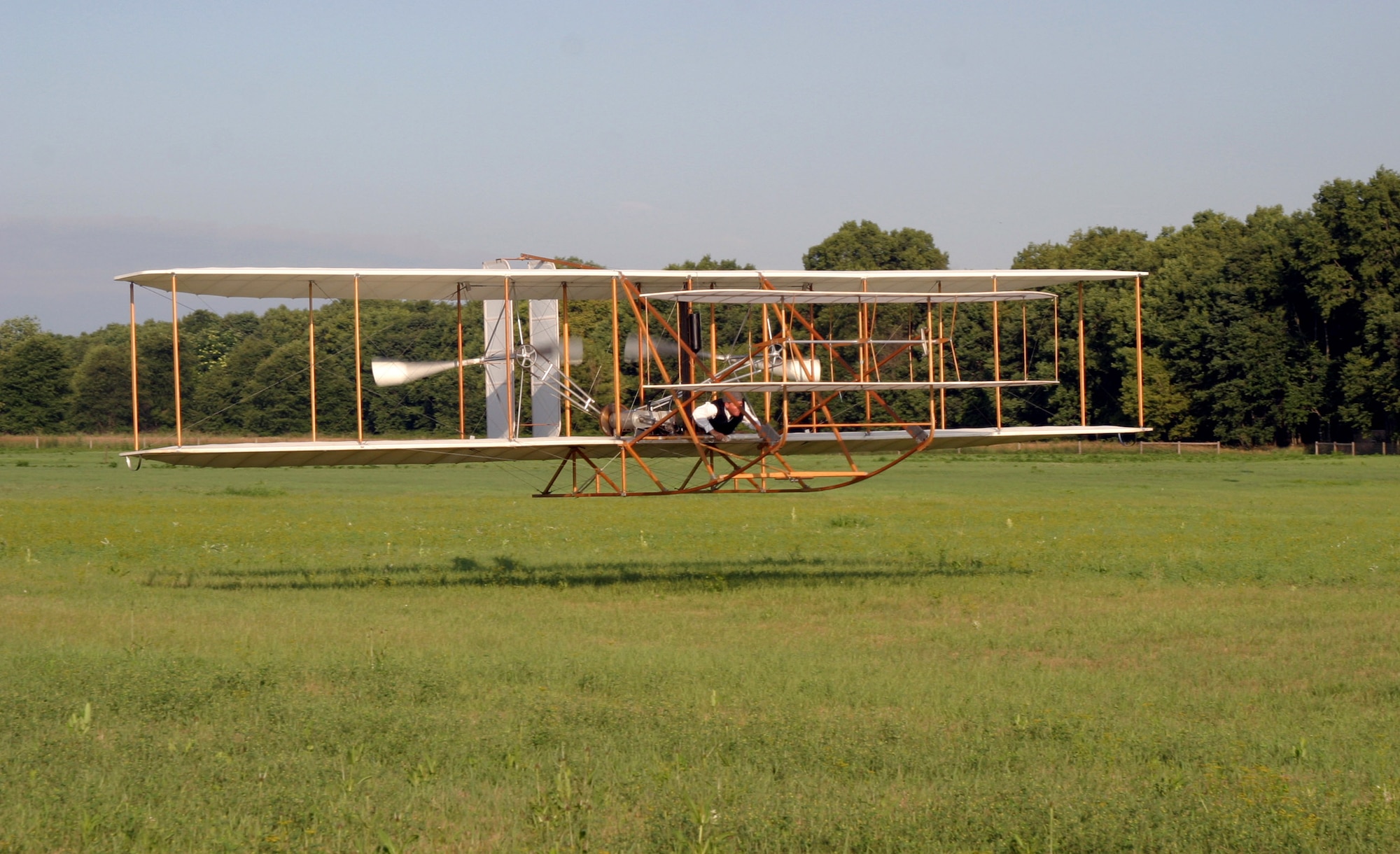 Vintage aircraft builder Mark Dusenberry pilots a replica Wright Flyer III Oct. 5 at Huffman Prairie Flying Field. He flew for about 40 seconds before a wingtip struck the ground while turning. Mr. Dusenberry was not hurt but his aircraft suffered damage to the undercarriage and both propellers. The incident took place during a reenactment of the first practical circling flight by a powered aircraft during a National Park Service and Aviation Heritage Foundation-sponsored event at Wright-Patterson Air Force Base, Ohio. (Courtesy photo) 