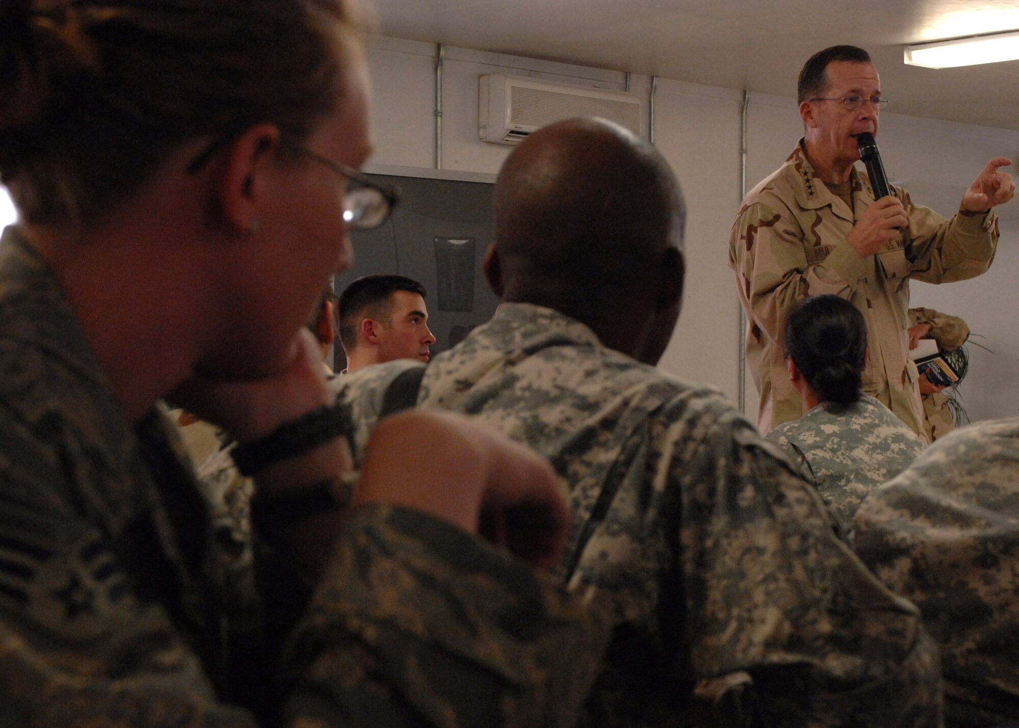 Adm. Michael Mullen, chairman of the Joint Chiefs of Staff, thanks servicemembers for their service during an All-Hands Call for E-6s and below at Bagram Airfield, Afghanistan, Oct 7. (U.S. Air Force photo/Staff Sgt. Joshua Jasper)