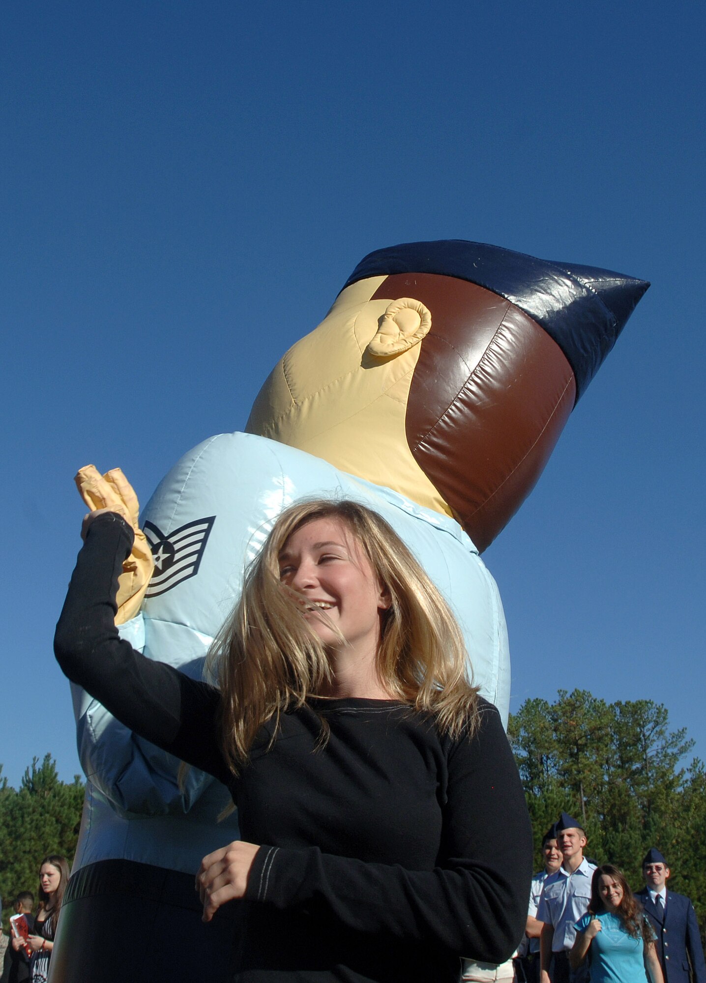 Student McKenna Lavery dances with a blown-up Airman mascot Oct. 10 during an Air Force Week Atlanta event at Etowah High School in Woodstock, Ga. (U.S. Air Force photo/Staff Sgt. Bennie J. Davis III) 