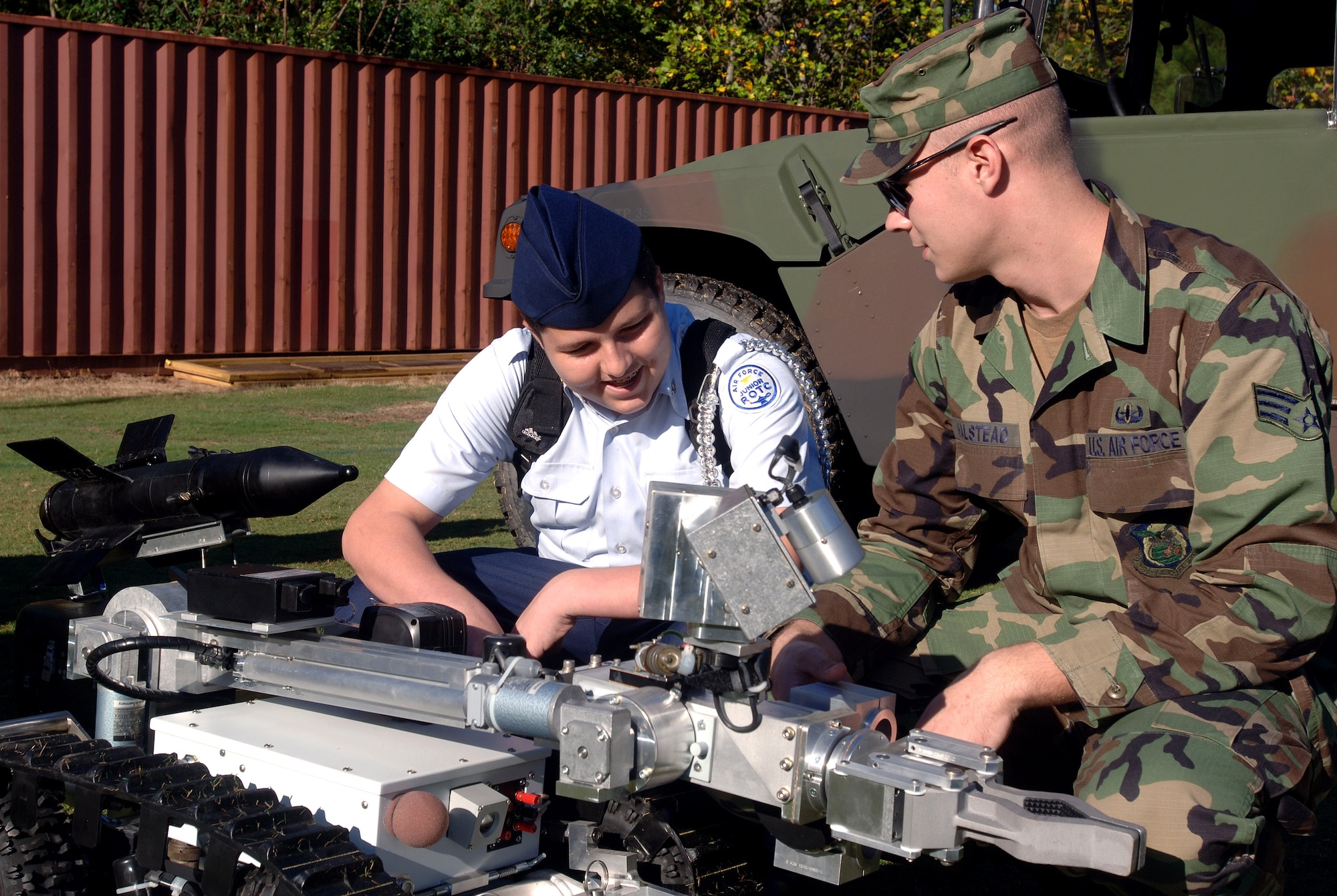 Senior Airman Matt Halstead an explosive ordinance device technician from the 94th Civil Engineering Squadron, Dobbins Air Reserve Base, Ga., demonstrates EOD equipment to Josh Shoemaker Oct. 10 during an Air Force Week Atlanta event at Etowah High School in Woodstock, Ga. (U.S. Air Force photo/Staff Sgt. Bennie J. Davis III) 
