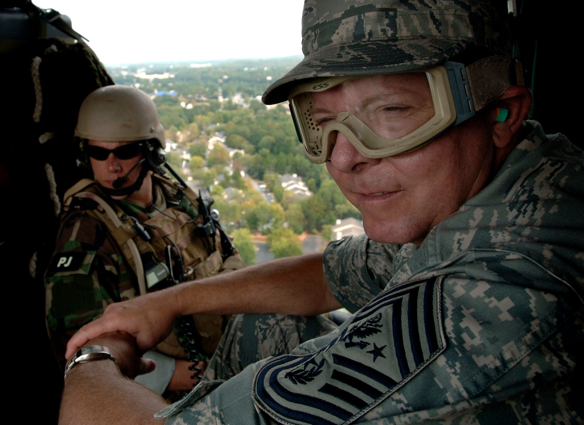 Chief Master Sergeant of the Air Force Rodney J. McKinley gets a birds-eye view of Atlanta Oct. 9 aboard a HH-60G Pave Hawk helicopter courtesy of the 920th Rescue Wing from Patrick Air Force Base, Fla., following an Air Force Week Atlanta event. (U.S. Air Force photo/Staff Sgt. Bennie J. Davis III) 
