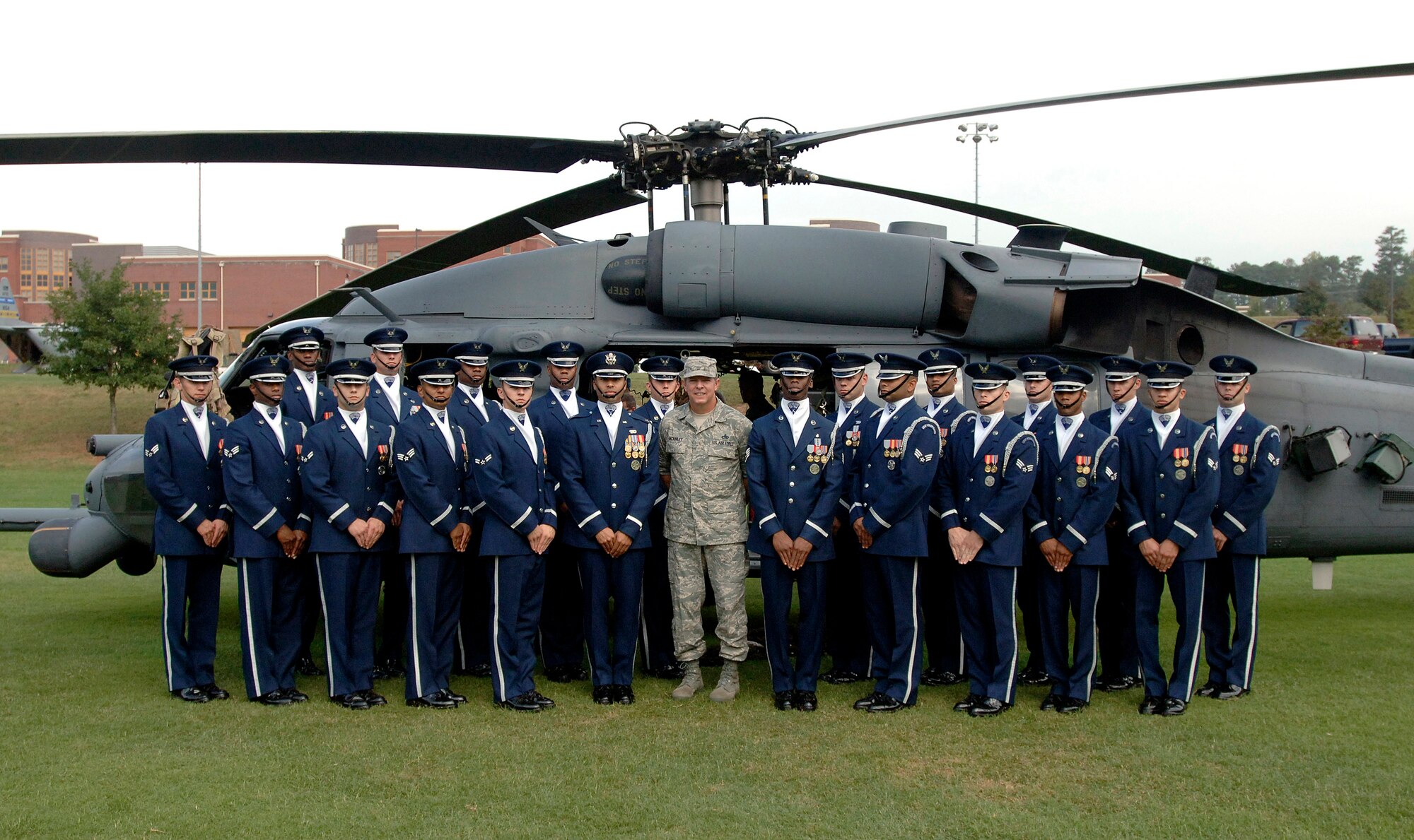 Chief Master Sergeant of the Air Force Rodney J. McKinley (center) stands before a HH-60G Pave Hawk helicopter with the U.S. Air Force Honor Guard Drill Team at Marietta High School Oct. 9 in Marietta, Ga., as part of the Air Force Week Atlanta events. (U.S. Air Force photo/Staff Sgt. Bennie J. Davis III) 
