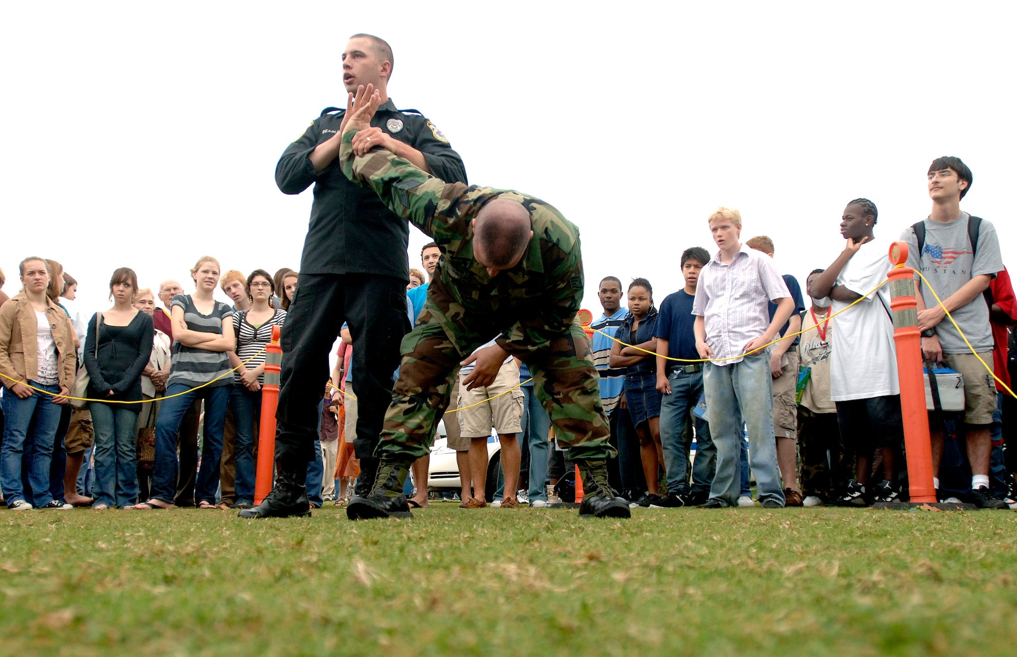 Staff Sgt's. Dustin Beasley (left) and Chris Wallace demonstrate self-defense maneuvers to Marietta High School students as part of an Air Force Week Atlanta event Oct. 9 in Marietta, Ga. The event helped to educate students about the U.S. Air Force. (U.S. Air Force Photo/Staff Sgt. Bennie J. Davis III) 
