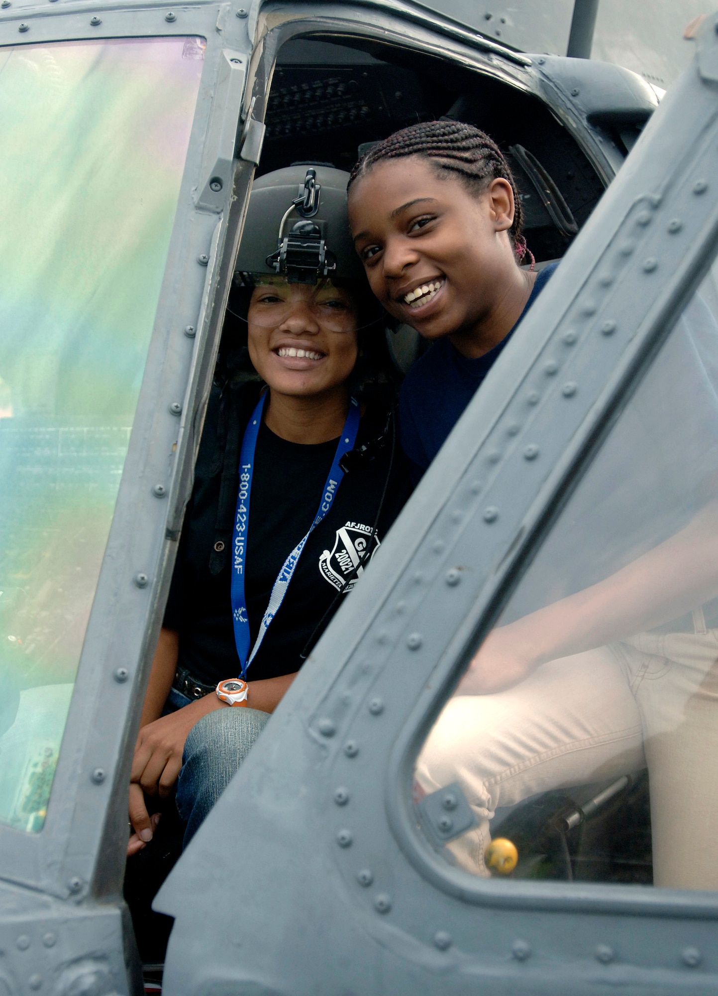 Marietta High School students Yesenia Quinones (left) and T-Keyah Duke interact with a HH-60G Pave Hawk helicopter as part of an Air Force Week Atlanta event an Air Force Week Atlanta event Oct. 9 in Marietta, Ga. The event helped to educate students about the U.S. Air Force. (U.S. Air Force photo/Staff Sgt. Bennie J. Davis III) 
