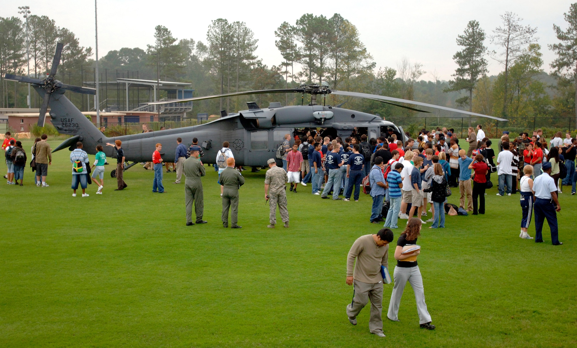 Marietta High School students interact with a HH-60G Pave Hawk helicopter as part of an Air Force Week Atlanta event Oct. 9 at Marietta High School in Marietta, Ga. The event helped to educate students about the U.S. Air Force. (U.S. Air Force photo/Staff Sgt. Bennie J. Davis III) 
