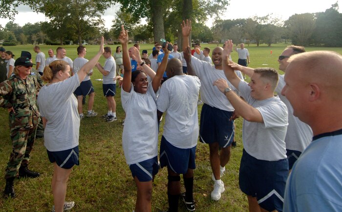 437th Airlift Wing Staff team celebrates after beating out the competition during the commander's challenge kickball tournament Oct 5.  (U.S. Air Force photo/Staff Sgt. April Quintanilla)