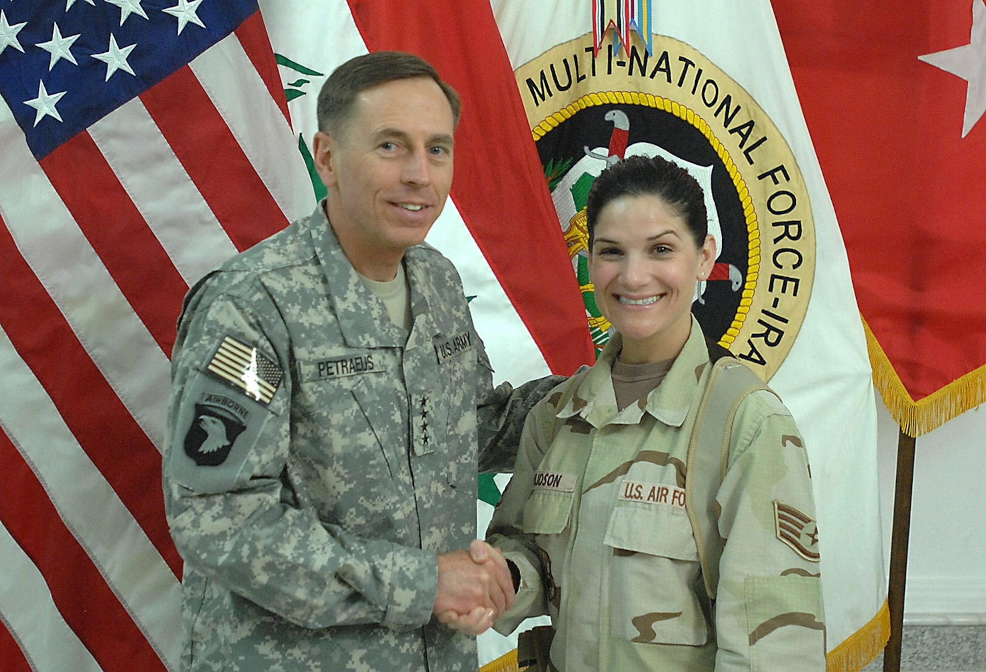 CAMP VICTORY, Iraq -- Gen. David H. Petraeus, Commanding General Multi-National Force - Iraq, shakes hands with Staff Sgt. Andrea Knudson Oct. 6, at the Al Faw Palace at Camp Victory in Baghdad, Iraq. Sergeant Knudson is a public affairs specialist assigned to the Joint Operations Center with Multi-National Corps Iraq. Her home duty station is Spangdahlem Air Base, Germany. (Photo courtesy of the U.S. Army).  
