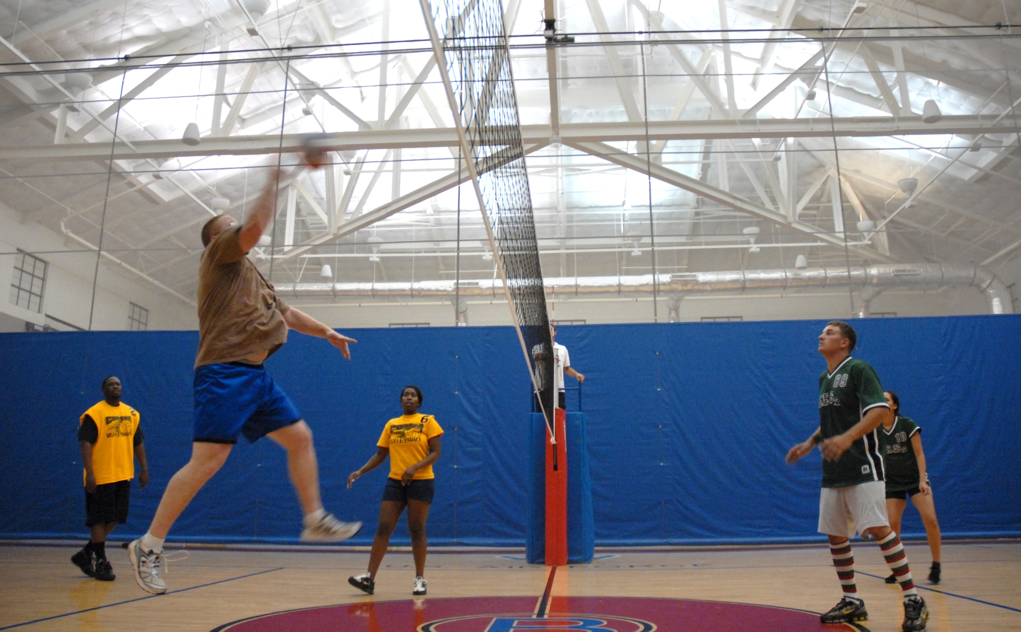 Master Sgt. Larry Simpson, 36th Communications Squadron, hits the ball over the net during an intramural volleyball game, Oct. 10.  The 36th CS won their game against the 36th Logistics Squadron. (U.S. Air Force photo/Senior Airman Miranda Moorer)
