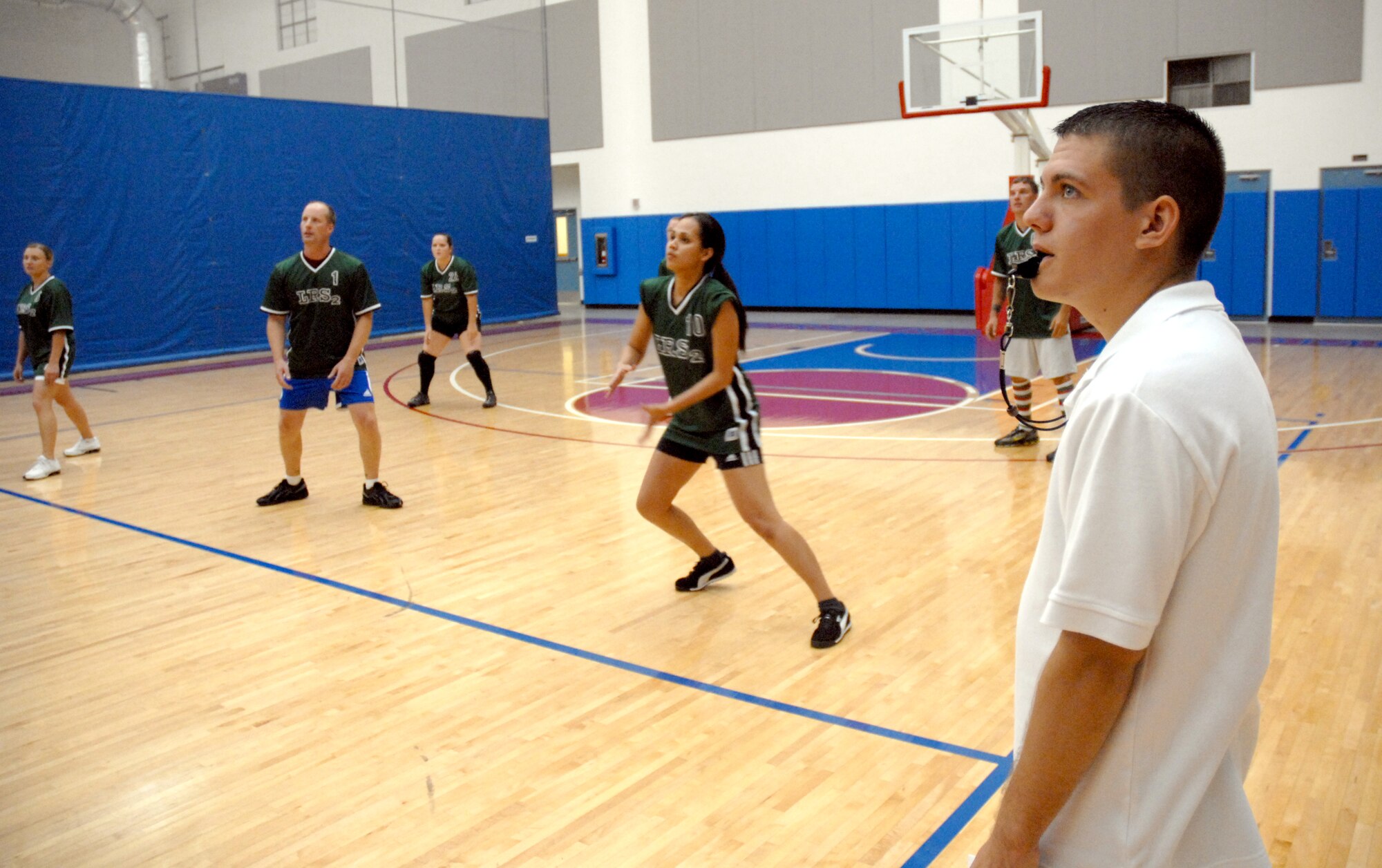 Airman 1st Class Ryan Musser, 36th Security Forces Squadron, refs for an intramural volleyball game, Oct. 10.  The squadrons playing were the 36th Communications Squadron and the 36th Logistics Readiness Squadron. (U.S. Air Force photo/Senior Airman Miranda Moorer)