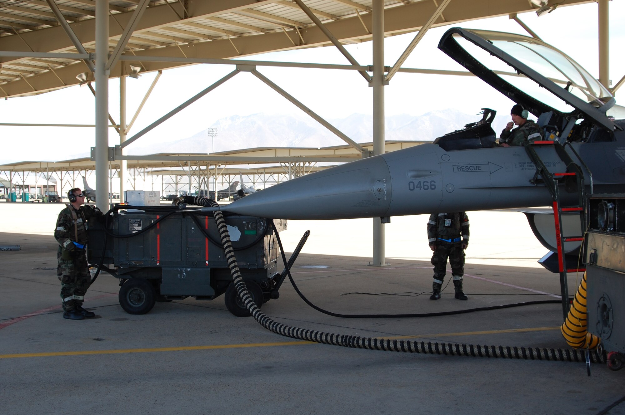 HILL AIR FORCE BASE, Utah-- Crew chiefs with the 388th Fighter Wing keep up maintenance on an F-16 in their chemical suits during Team Hill’s Operational Readiness Exercise here Oct. 11-14. This is the first time the 388th FW, 419th Fighter Wing and the Ogden Air Logistics Center have jointly participated in readiness exercises. (U.S. Air Force courtesy photo) 