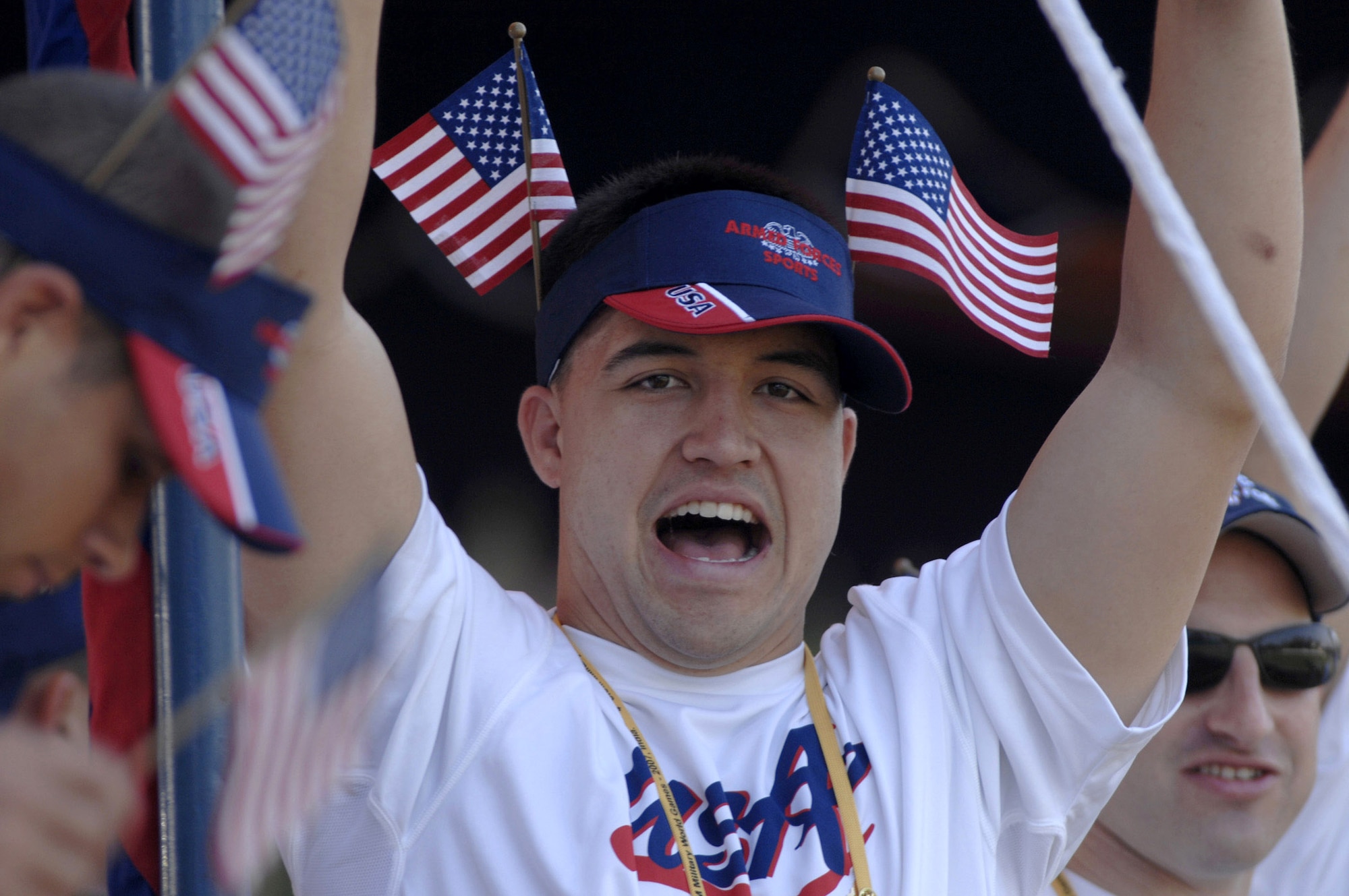 Mat Lewis cheers the U.S. military women's soccer team as they meet the Democratic Peoples Republic of Korea team during the Military World Games' women's soccer competition in Hyderabad, India, Oct. 14.  DPR Korea defeated the U.S. team 4-0. The Conseil Internationale du Sport Militaire's Military World Games event is the largest international military Olympic-style event in the world. In this year's fourth edition of the games, 103 countries and more than 5,000 athletes are competing Oct. 14 to 21 in boxing, diving, soccer, handball, judo, military pentathlon, parachuting, sailing, shooting, swimming, volleyball and track and field. The purpose of the Military World Games is to promote "friendship through sport."  (U.S. Air Force photo/Tech. Sgt. Cecilio Ricardo Jr.)
