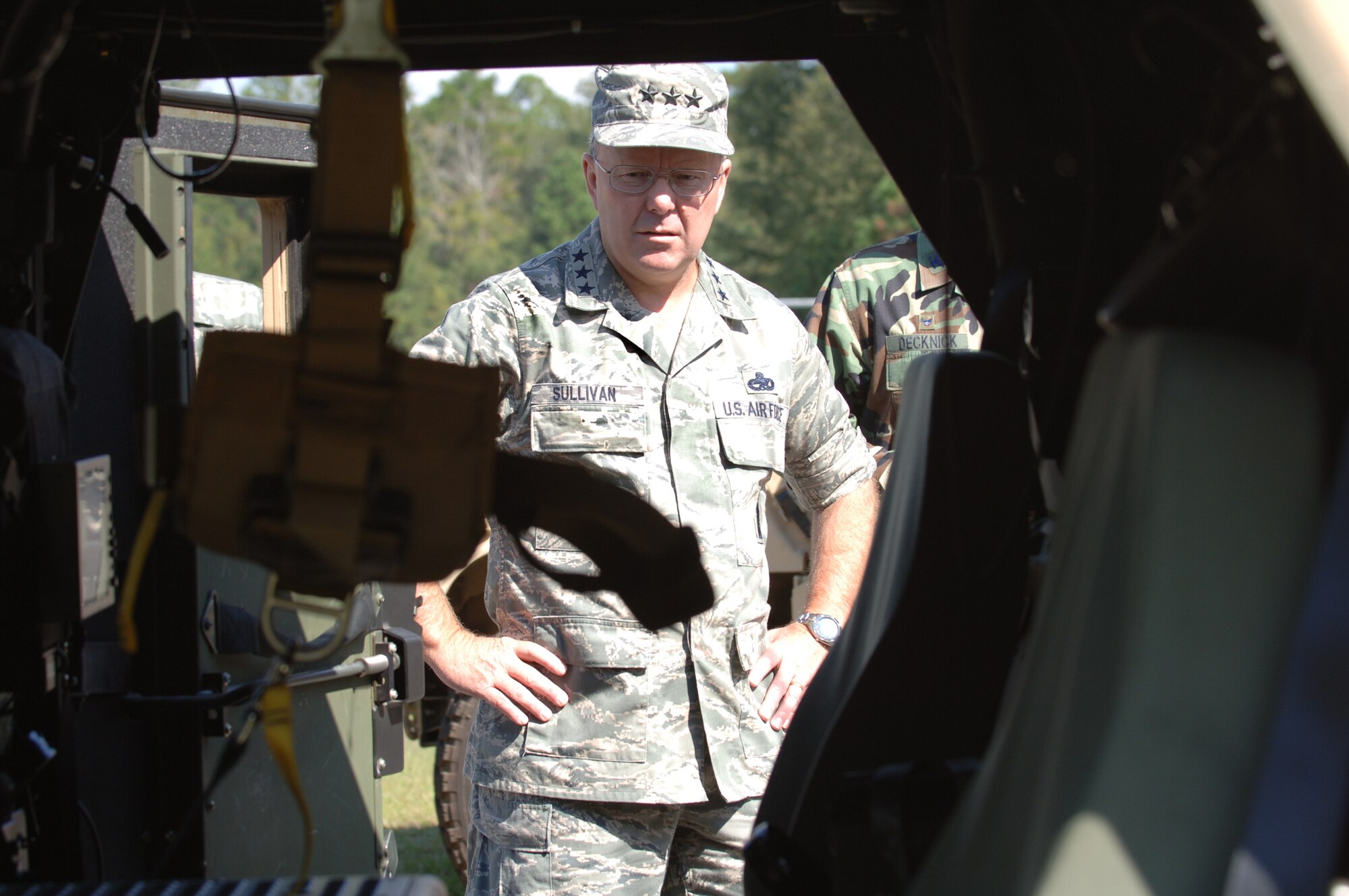 MOODY AIR FORCE BASE, Ga. -- Lt. Gen. Kevin Sullivan, U.S Air Force deputy chief of staff for logistics, installations and mission support, inspects an up-armored Frag 5 Humvee during a tour of the 820th Security Forces Group here Oct. 15. The five-man wheeled vehicle is used for convoy protection and patrol missions where its crew may encounter improvised explosive devices. (U.S. Air Force photo by Senior Airman Schelli Jones)