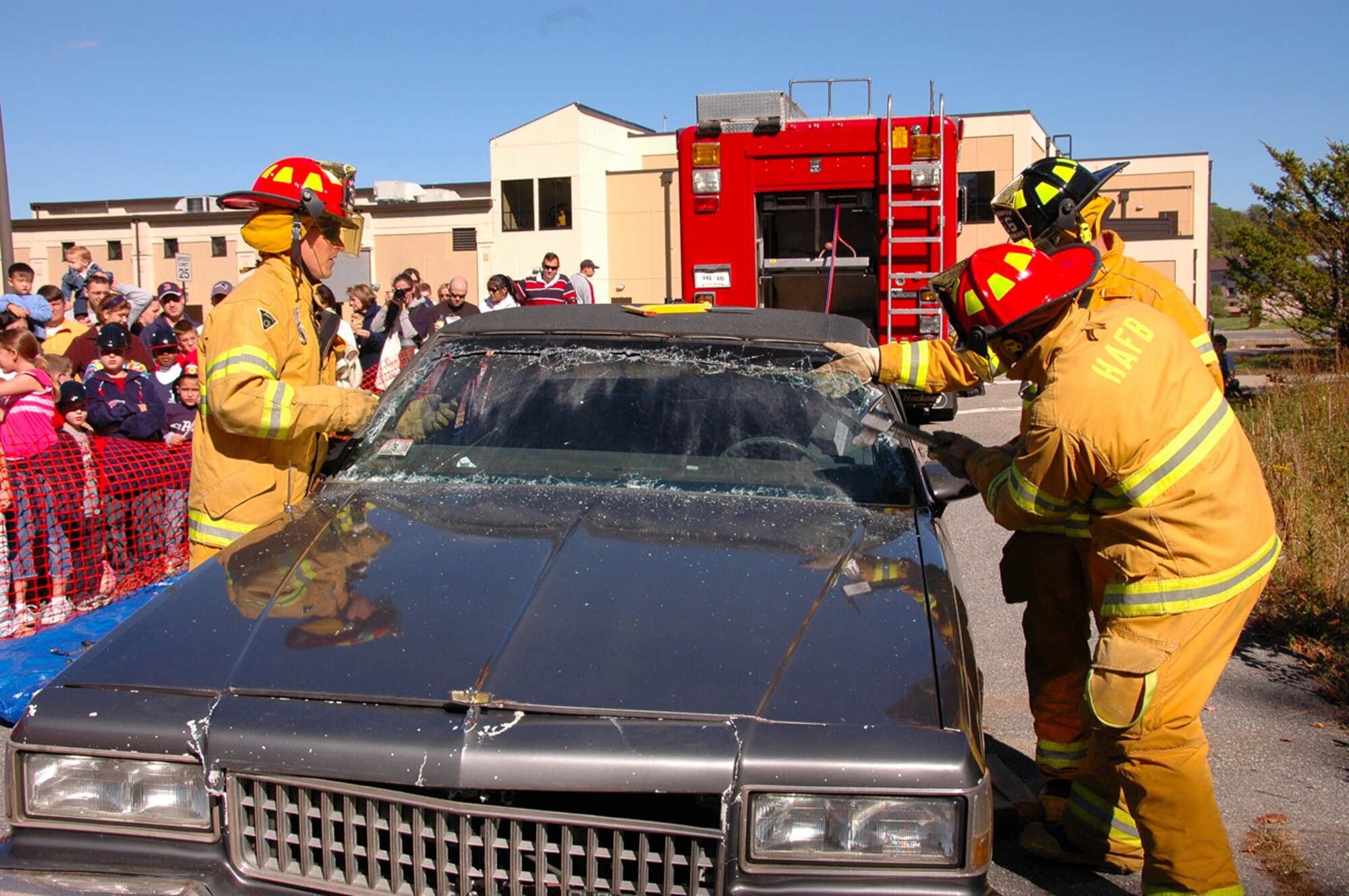 HANSCOM AFB, Mass. – Hanscom firefighters demonstrate emergency auto evacuation procedures in front of base community members on Oct. 13. The event, which featured fire safety demonstrations and info, culminated Fire Prevention Week. This year’s Fire Prevention theme was “Plan Your Escape.” (U.S. Air Force photo by Dennis Lewis)