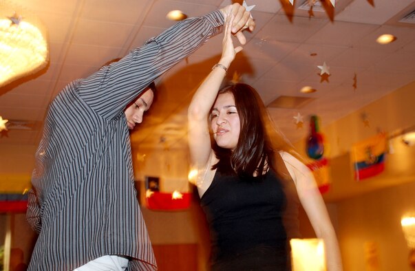 Airman 1st Class Peter Henriquez, 319th Missile Squadron, and Airman 1st Class Liz Berrocal, 320th MS, salsa dance during the Hispanic American Heritage Committee’s Salsa Night in the Trail’s End Club Sept. 28. The HAHC is also hosting a Hispanic Heritage Luncheon Oct. 12 in the Pronghorn Center from 11:30 a.m. to 1 p.m. (Photo by Airman 1st Class Daryl Knee).