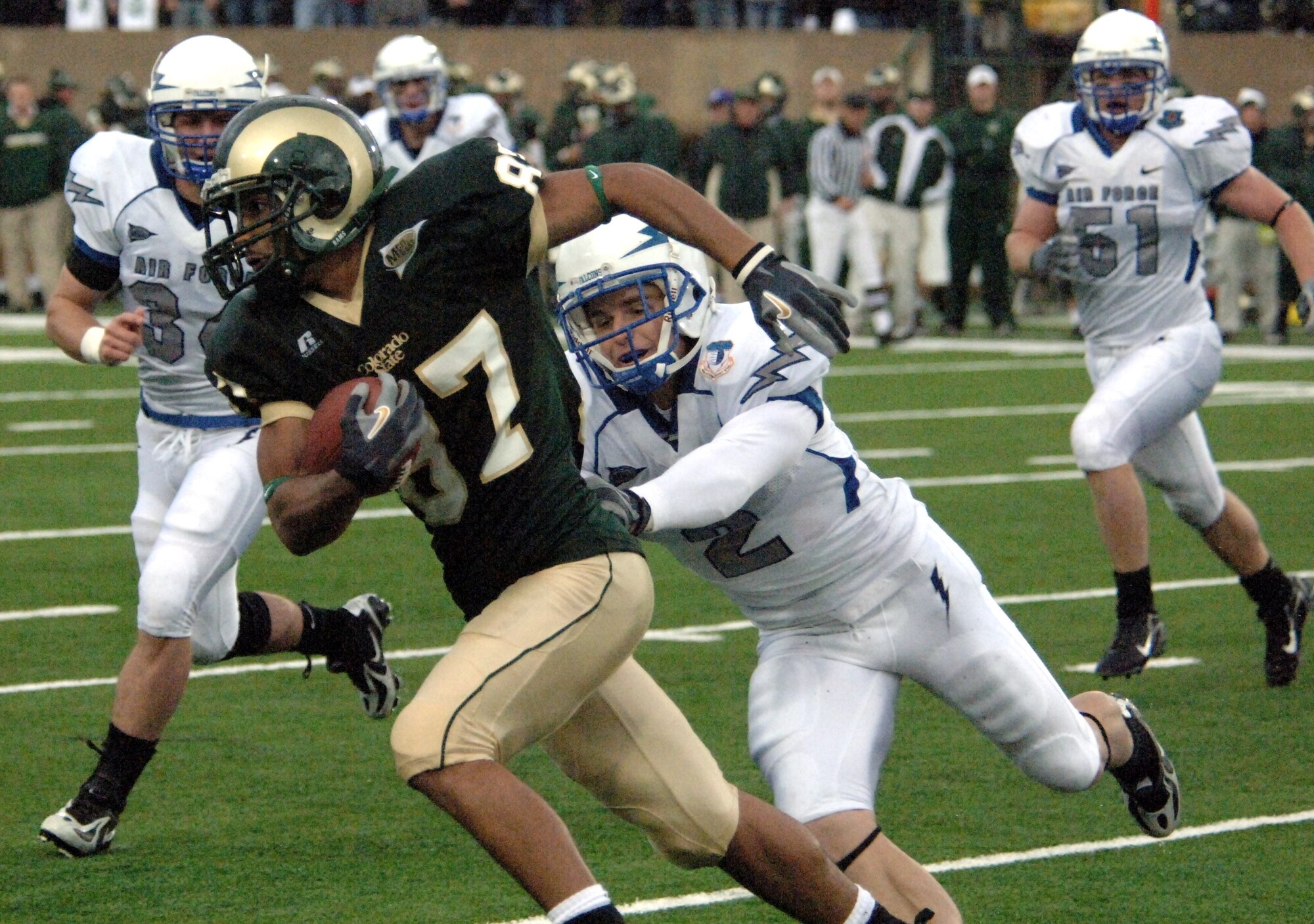Falcon cornerback Carson Bird, 2, runs down Colorado State wide receiver Damon Morton during Air Force's 45-21 victory over the Rams Oct. 13 in Fort Collins, Colo., as teammate Chris Thomas closes in. Bird led the aggressive Air Force secondary with two interceptions. (U.S. Air Force photo/John Van Winkle)