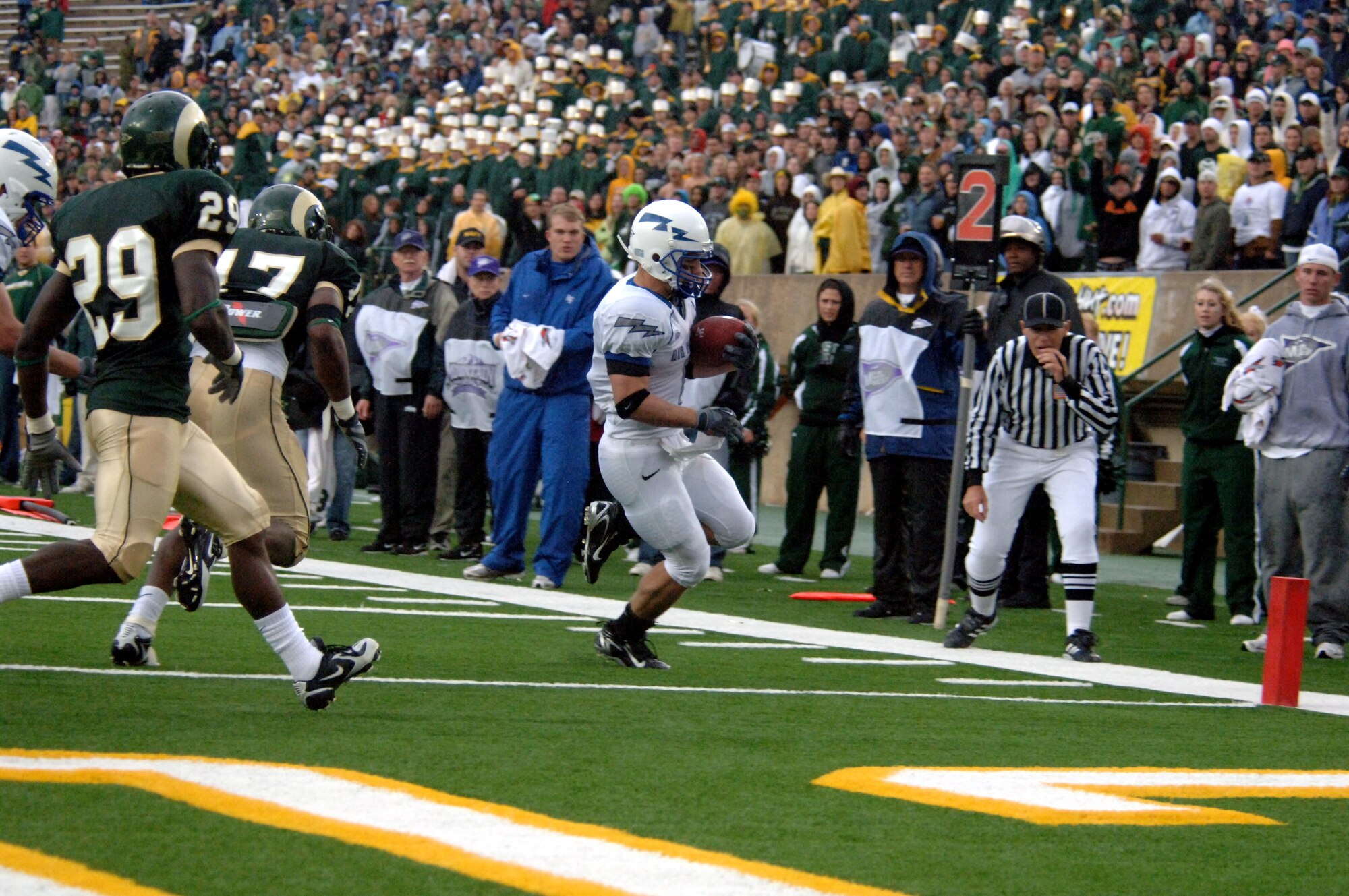 Falcon Chad Hall steps into the corner of the end zone for one of his four touchdowns during Air Force's 45-21 victory over the Colorado State Rams Oct. 13 in Fort Collins, Colo. Hall broke the Academy's all-time single-game rushing record with 256 yards on 31 carries. (U.S. Air Force photo/John Van Winkle)