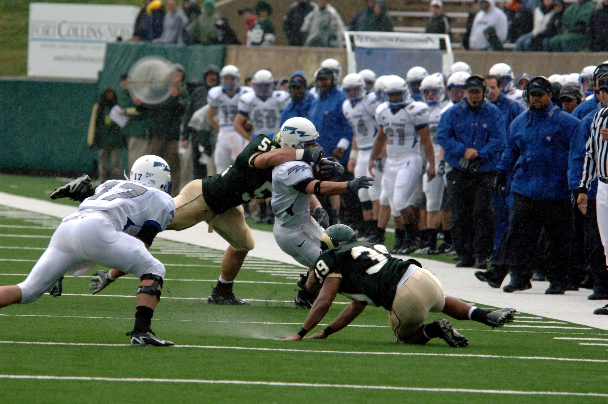 Colorado State linebacker Connor Smith grabs a handful of Falcon Chad Hall's face mask during the bluesuiters' 45-21 win over the Rams Oct. 13 in Fort Collins, Colo. The play didn't slow Hall down as he set the Academy's all-time single-game rushing record with 256 yards on 31 carries. (U.S. Air Force photo/John Van Winkle)
