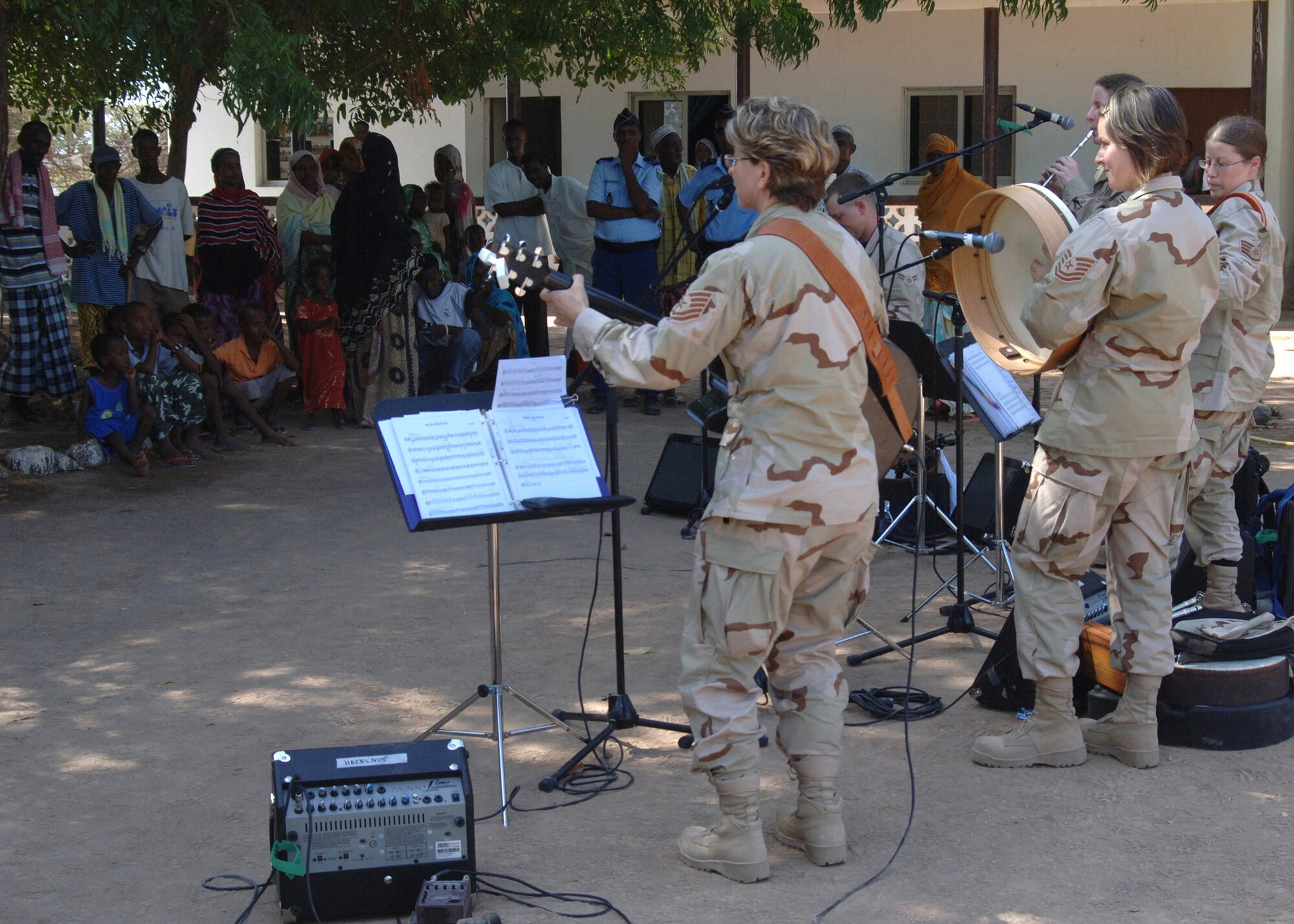 The U.S. Central Command Air Forces Expeditionary Band, the "Desert Ramblers," perform for local villagers Oct. 9 in Damerjog, Djibouti. The band was in the area for a tour stop at Camp Lemonier, Djibouti. (U.S. Navy photo/Navy Petty Officer 2nd Class Regina L. Brown)
