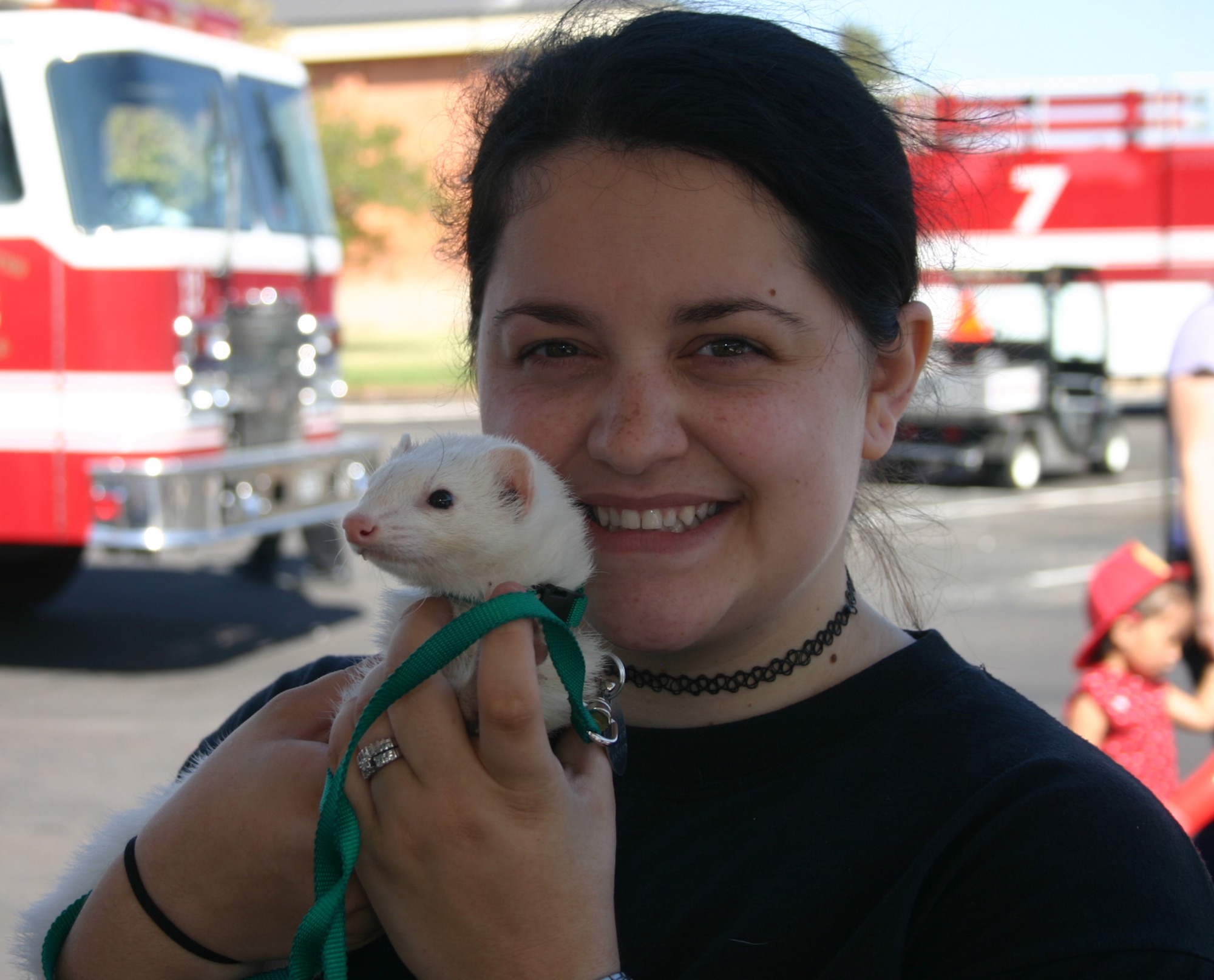 Josephine Neal poses with her first-place winner in the unique breed competition, ferret Pogo.  Pets of all types were allowed in the Dog Show at the base exchange parking lot Oct. 13.  (U.S. Air Force photo/Staff Sgt. Tonnette Thompson)