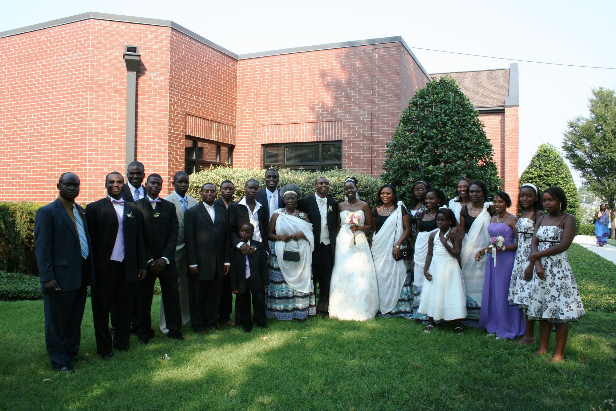 Aerospace Testing Alliance Data Analysis Engineer Jean Paul Mihigo, center, joined his family for a group photo after his wedding at Nashville’s St. Edwards Catholic Church in August. From left are Theophile Murayi(brother-in-law), Regis Murayi (nephew), Revocat Murayi (nephew), Aubin Gatorano (nephew), Christel Tuyishime (nephew), Jean Pierre Nsabimana (brother who is the priest), Jean Remi Bizimana (youngest brother), Yanick Balihe (nephew), Elyse Bajeneza (nephew), Roger Murayi (nephew), Rosalie Nyirantabaruke (mother), Jean Paul Mihigo, Albertine Mihigo (wife), Antoinette Uwimana (sister), Raissa Iradukunda (niece), Marie Therese Uwiragiye (sister), Dorine Balihe (niece), Monique Muhayimana (sister), Immaculee Uwayezu (sister), Marie Jeanne Mukeshimana (sister), Lisa Iradukunda(niece), and Jennifer Andagire (niece). (Photo provided)