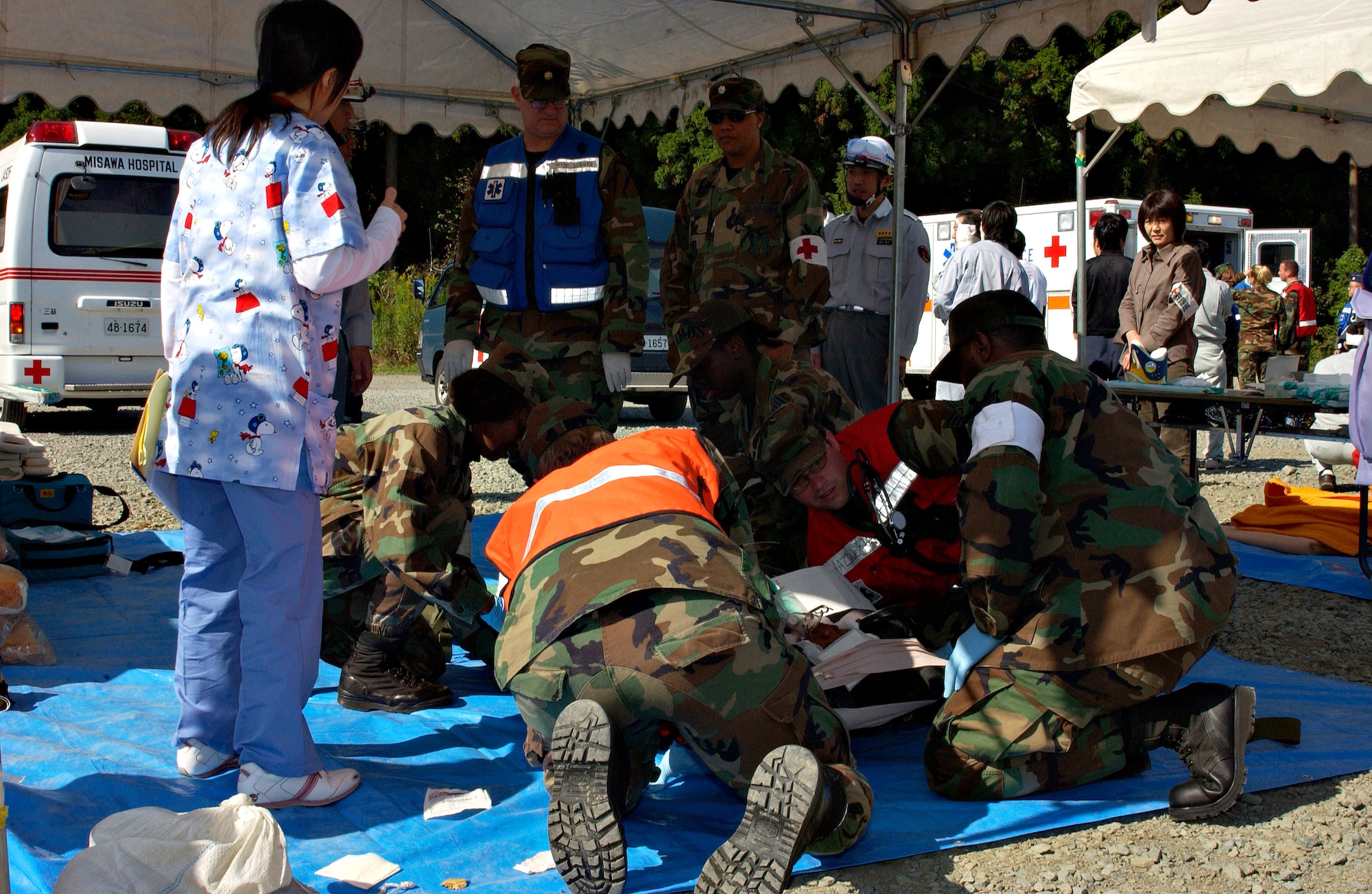 MISAWA AIR BASE, Japan -- Lt. Col. Yolanda Bledsoe, 35th Medical Operations Squadron commander, oversees Misawa Air Base medical personnel as they prepare to transport a victim during the Misawa City Disaster Preparation Exercise held at the Misawa Ice Arena Oct. 14, 2007. (US Air Force photo by Airman 1st Class Eric Harris)(RELEASED)
