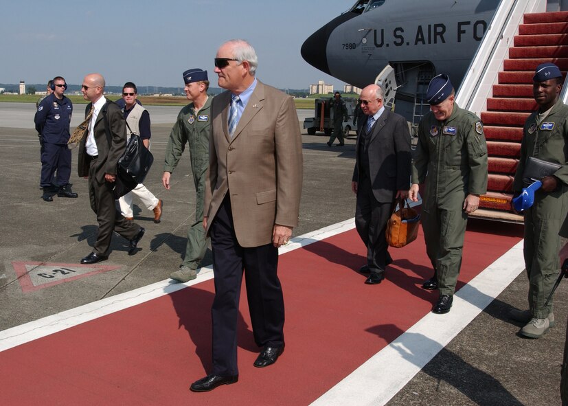 YOKOTA AIR BASE, Japan - The Honorable Michael Wynne, Secretary of the Air Force,walks away from his plane followed by Lt. General Bruce Wright, commander 5th Air Force and United States Forces Japan, and members of Secretary Wynne's staff upon arriving on October 7, 2007.  Secretary Wynne was touring numerous Air Force bases and held a town hall meeting on Yokota in which he discussed various topics concerning the future of the Air Force. (U.S. Air Force photo by Airman First Class Jonathan Fowler)                                                          