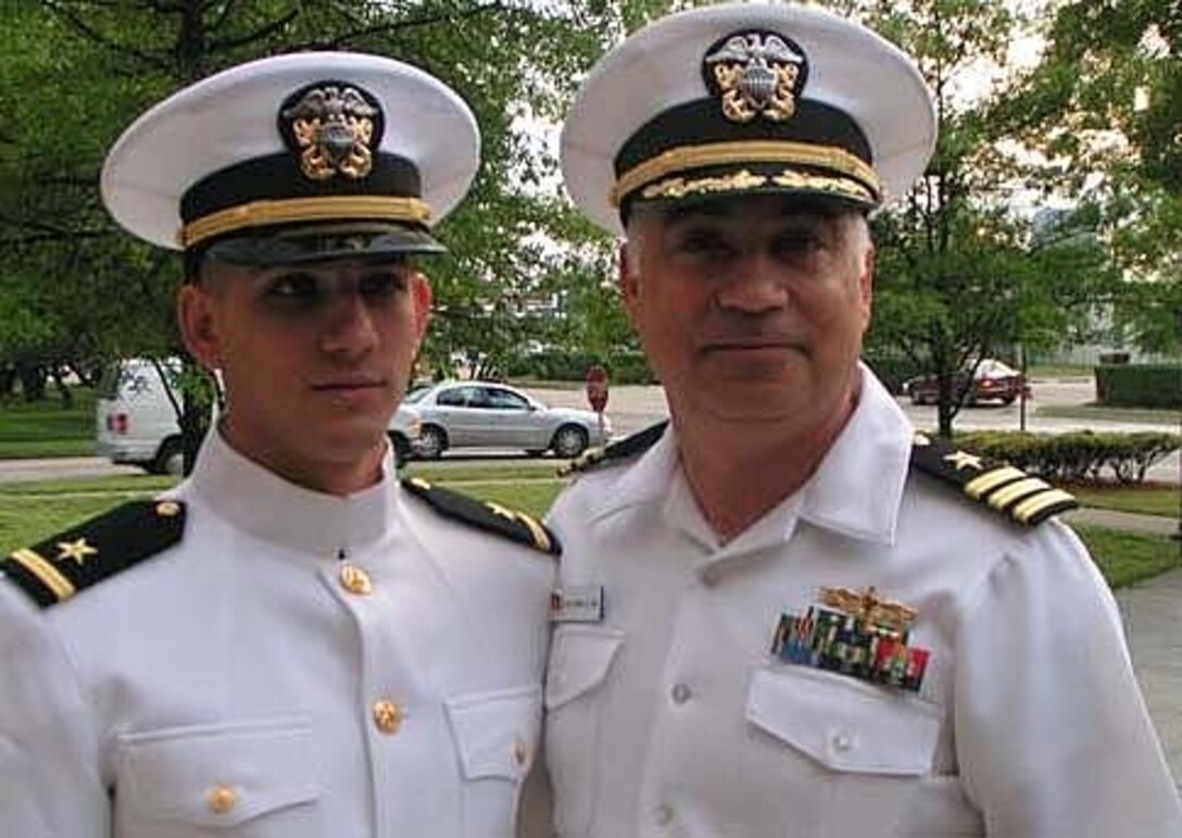 Now-retired Navy Cmdr. Hesham Islam (right), special assistant for international affairs to Deputy Defense Secretary Gordon England, poses before his retirement with his son, now Lt. j.g. Rami Islam. Five generations of the Islam family have served as naval officers. Courtesy photo