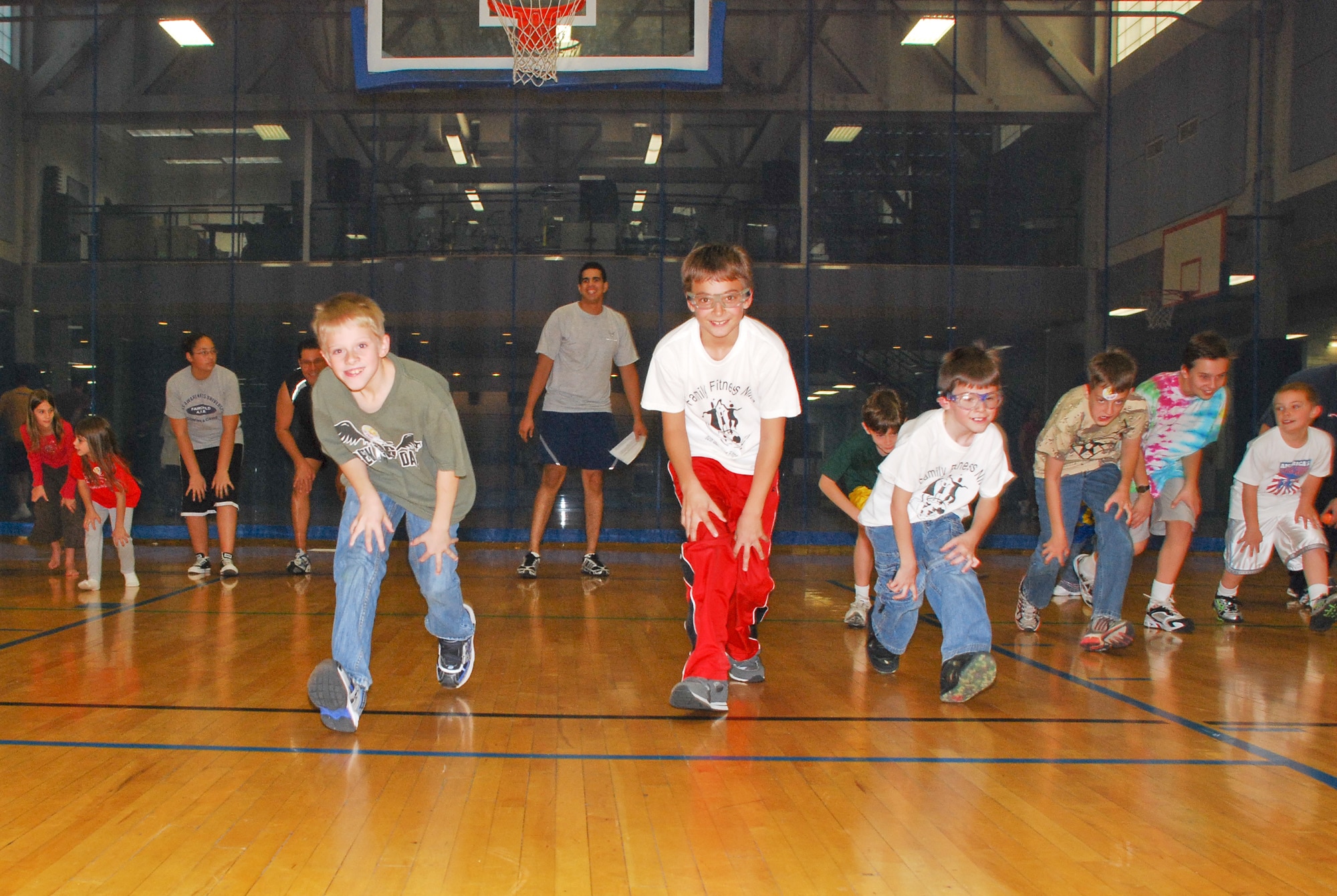 FAIRCHILD AIR FORCE BASE, Wash. -- Children participating at the Family Fitness Night take part in the animal parade by making the motions of certain animals at the base Fitness Center Oct. 11. Family Fitness Night was designed to provide families with activities to promote health, fitness, and fun. (U.S. Air Force photo / Staff Sgt. Mikel Daniel)