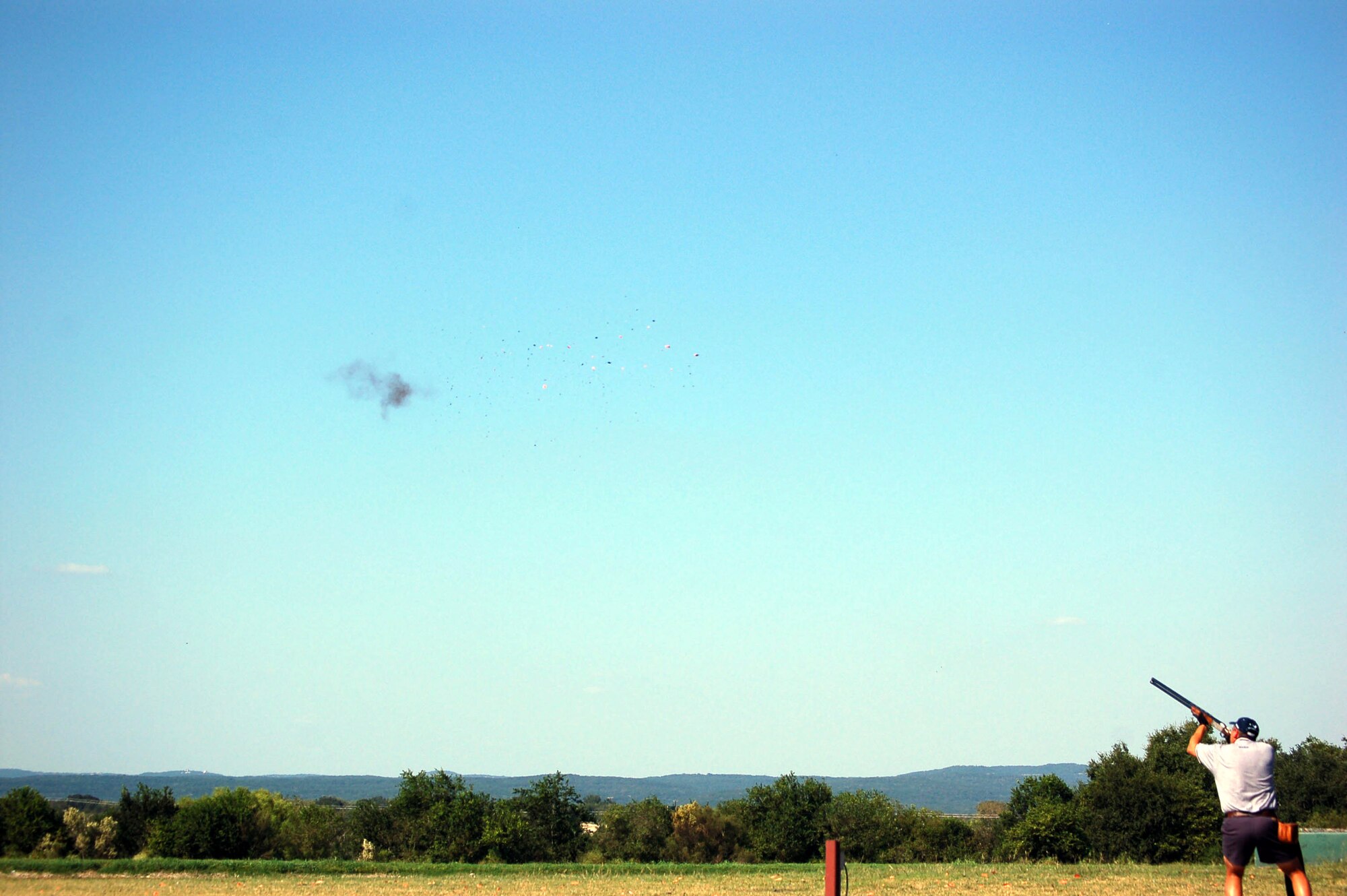 Capt. Brian Moore, shooting at station 8 low, nails it at the 2007 World Skeet Championship Oct. 12 in San Antonio, Texas. Moore took second in the overall military category losing out only to teammate Stuart Brown.  (U.S. Air Force photo/Staff Sgt. Jeremy Larlee)