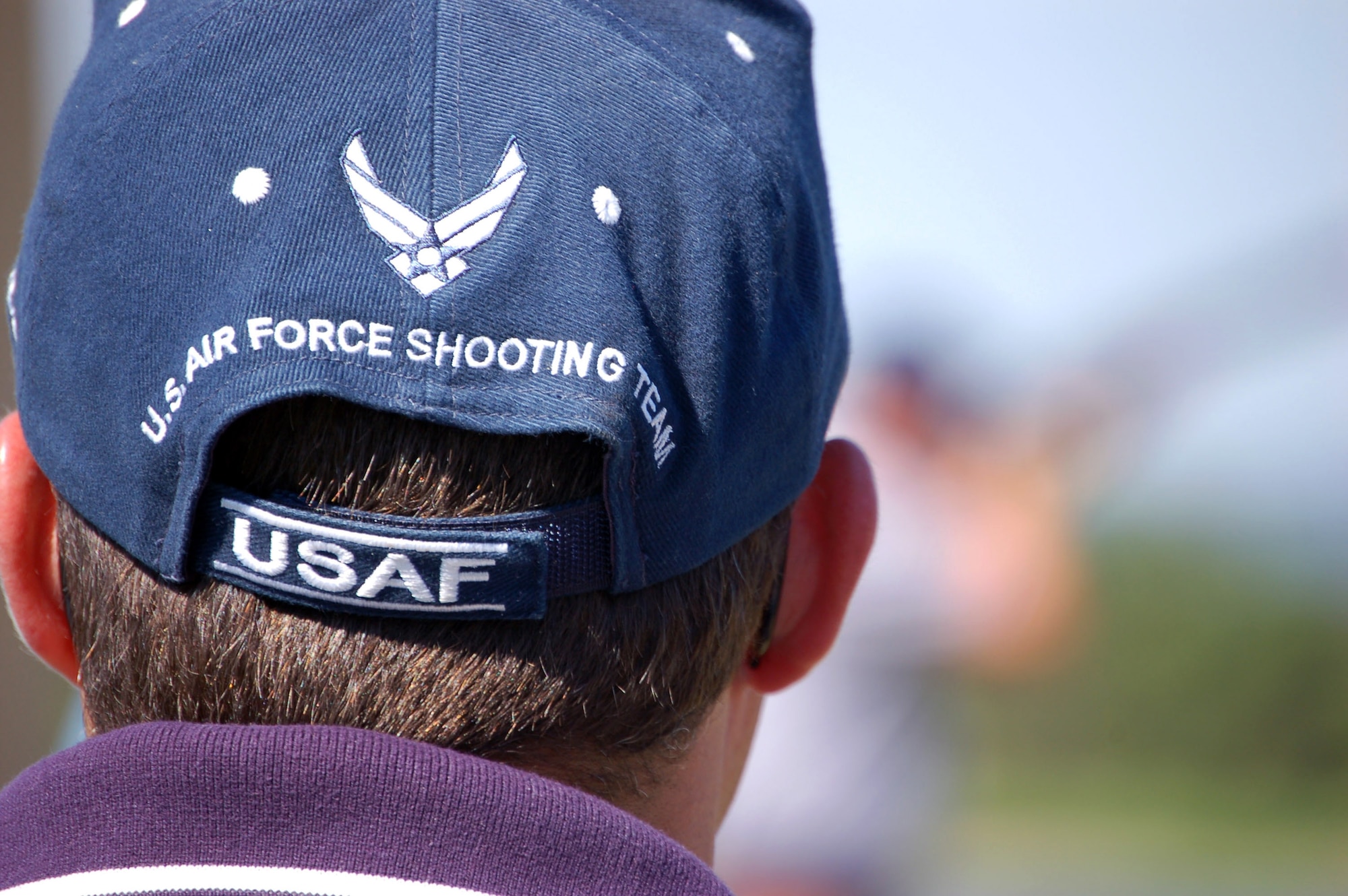 A member of the skeet shooting team looks on as squad members prepare for competition in the 2007 World Skeet Championship. Air Force teams took both first and second places among all the military teams at the competition. (U.S. Air Force photo/Staff Sgt. Jeremy Larlee)
